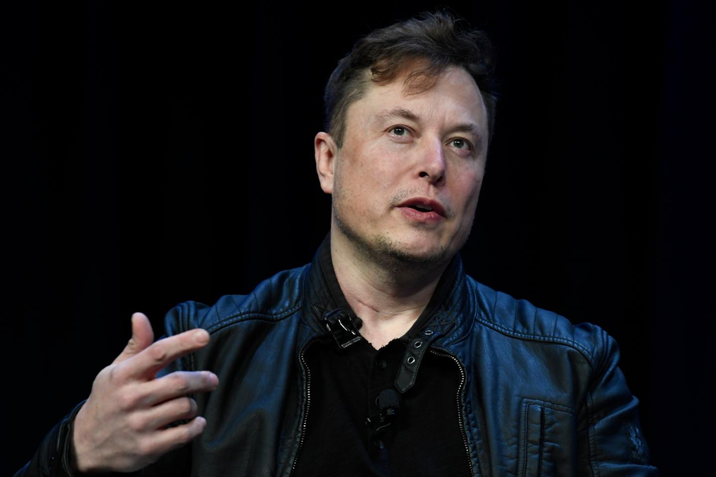 Tesla CEO Elon Musk speaks at the SATELLITE Conference and Exhibition on March 9, 2020, in Washington. Lawyers for Tesla shareholders suing Musk over a misleading tweet are urging a federal judge to reject the billionaire's request to move an upcoming trial to Texas from California. 