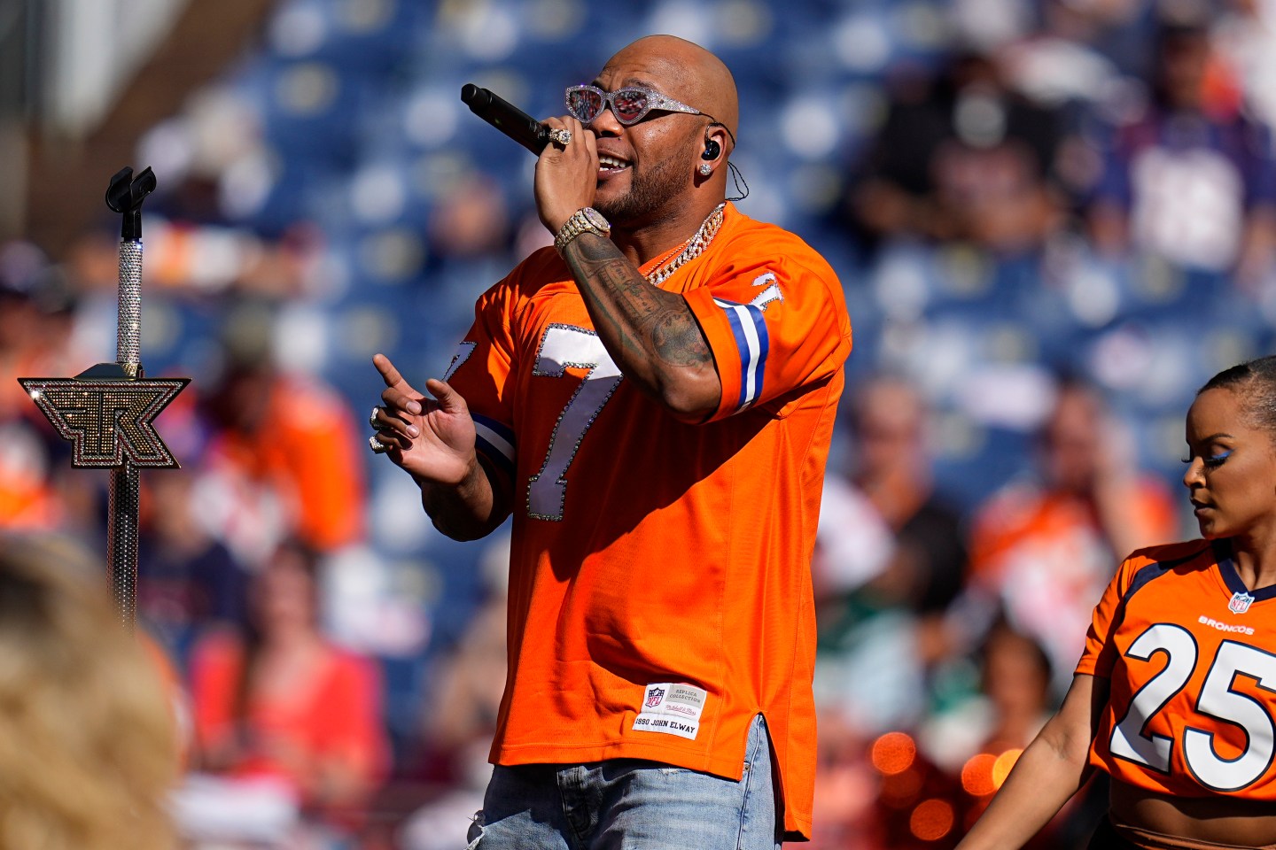 Singer Flo Rida performs at halftime during of an NFL football game.