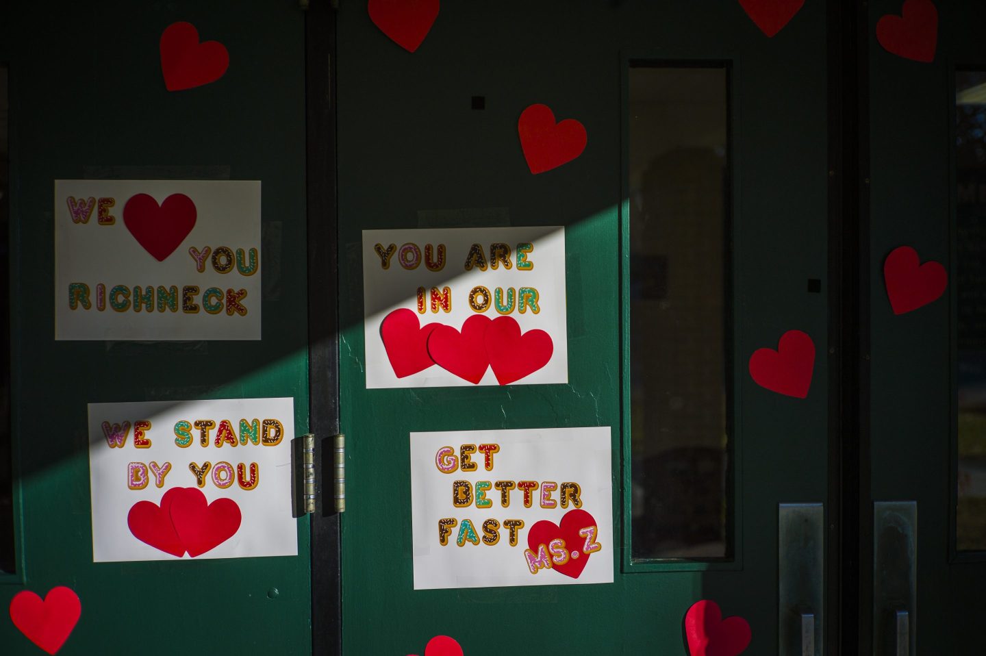 Messages of support on a wall for the teacher who was shot.