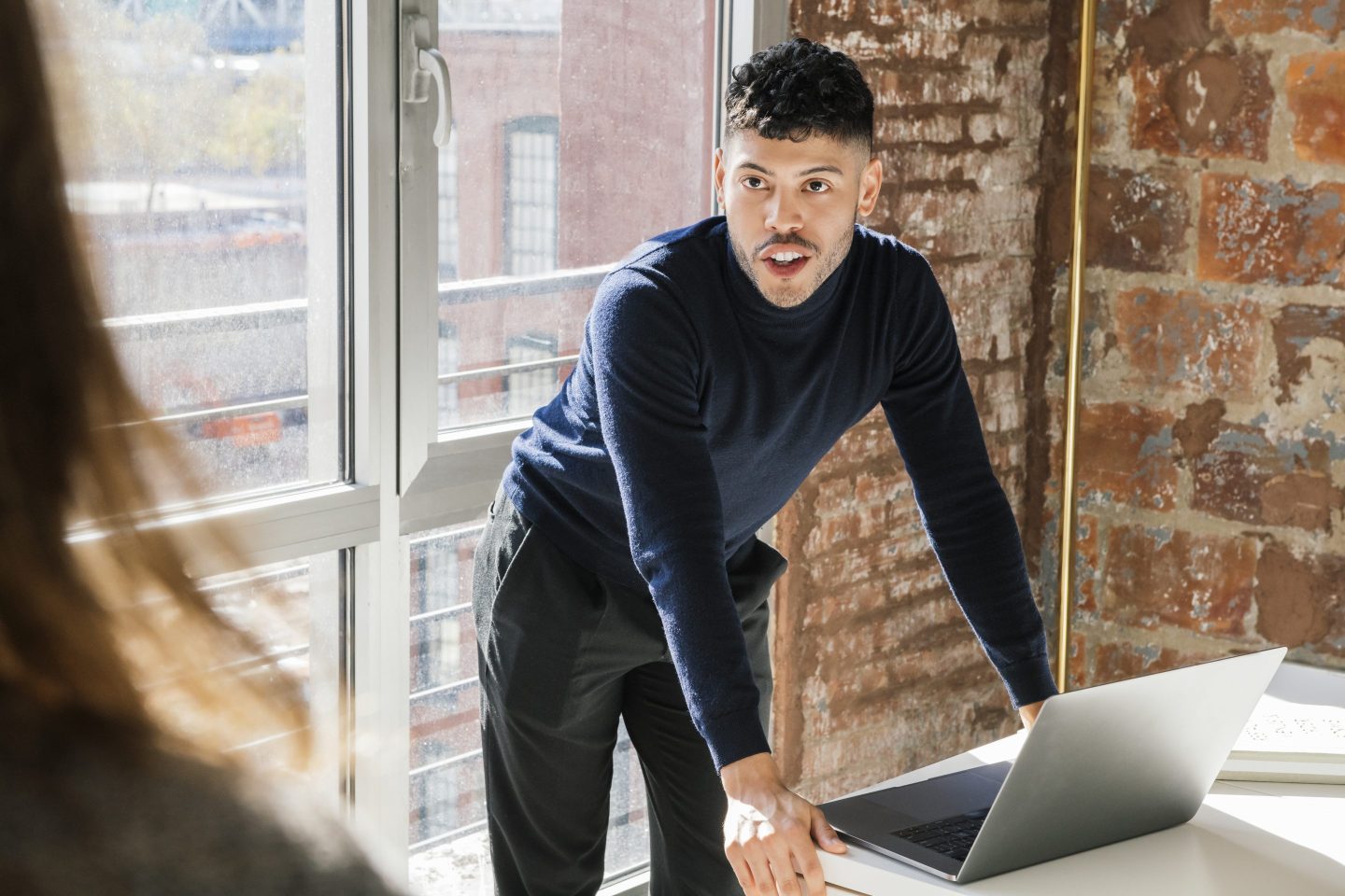 Man posing by his laptop