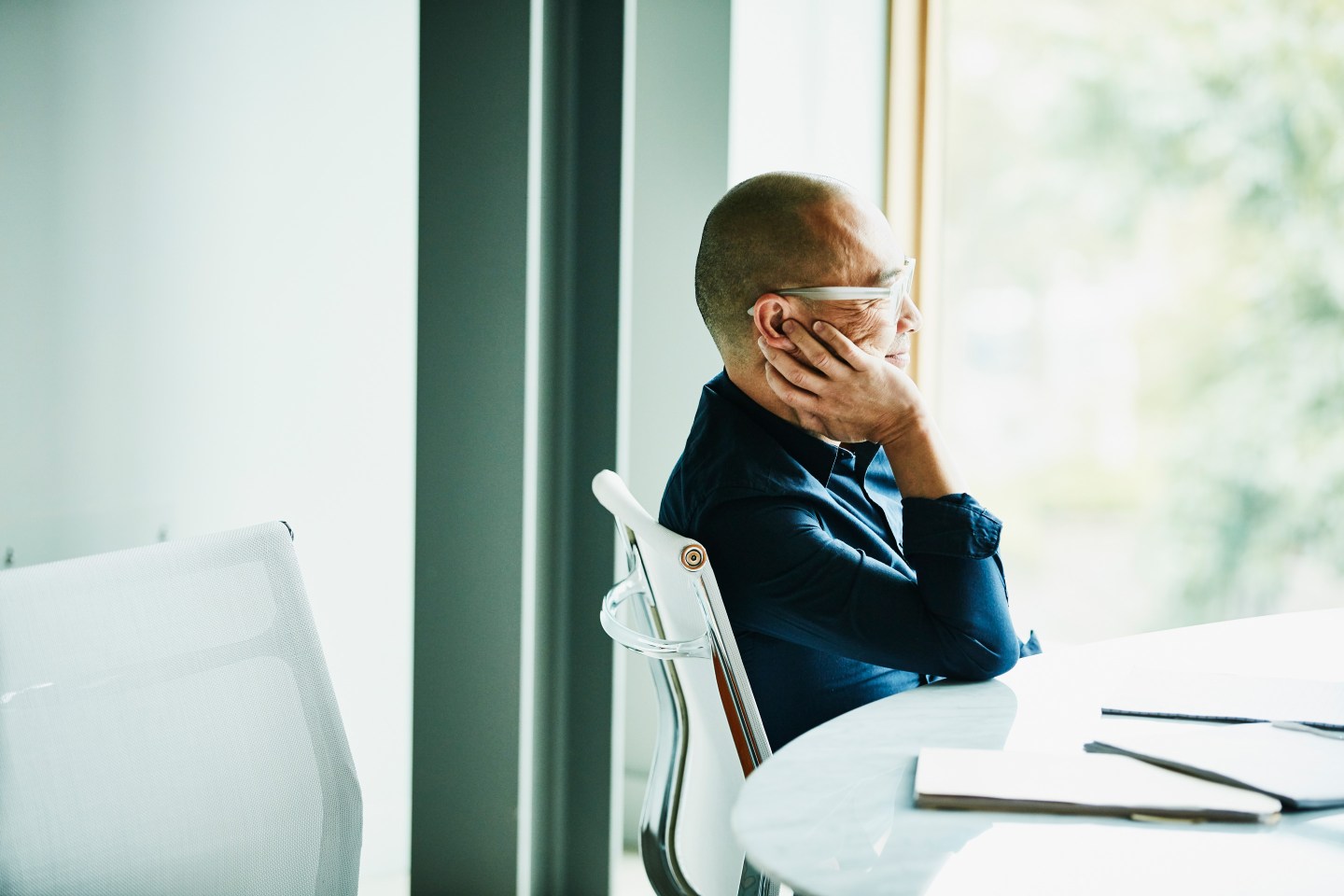 Businessman in deep thought in a conference room