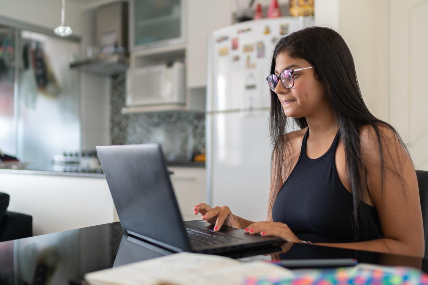 Young woman on latop at home