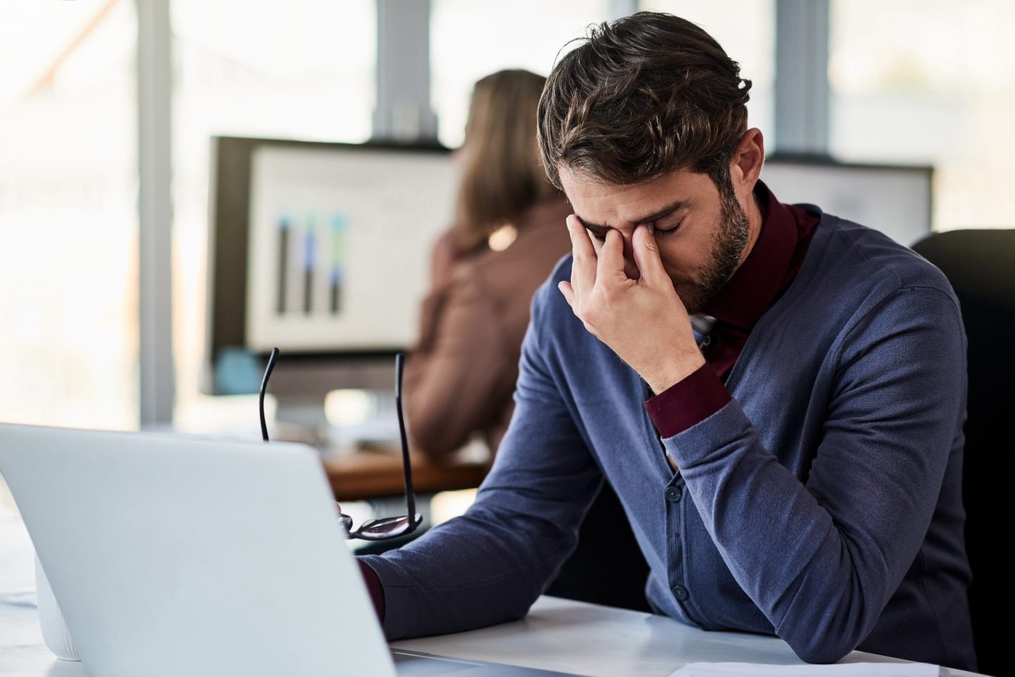 A stressed looking man pitches his brow