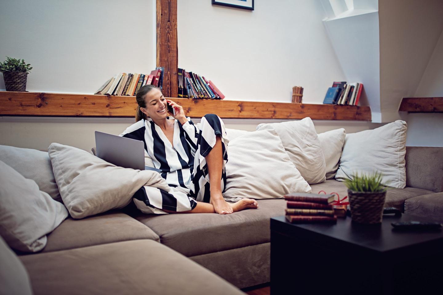 Woman working from home on sofa