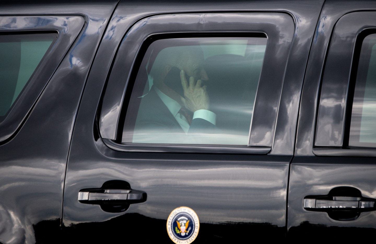 President Joe Biden talks on his cell phone after arriving on Marine One in Washington, D.C., June 4, 2021.