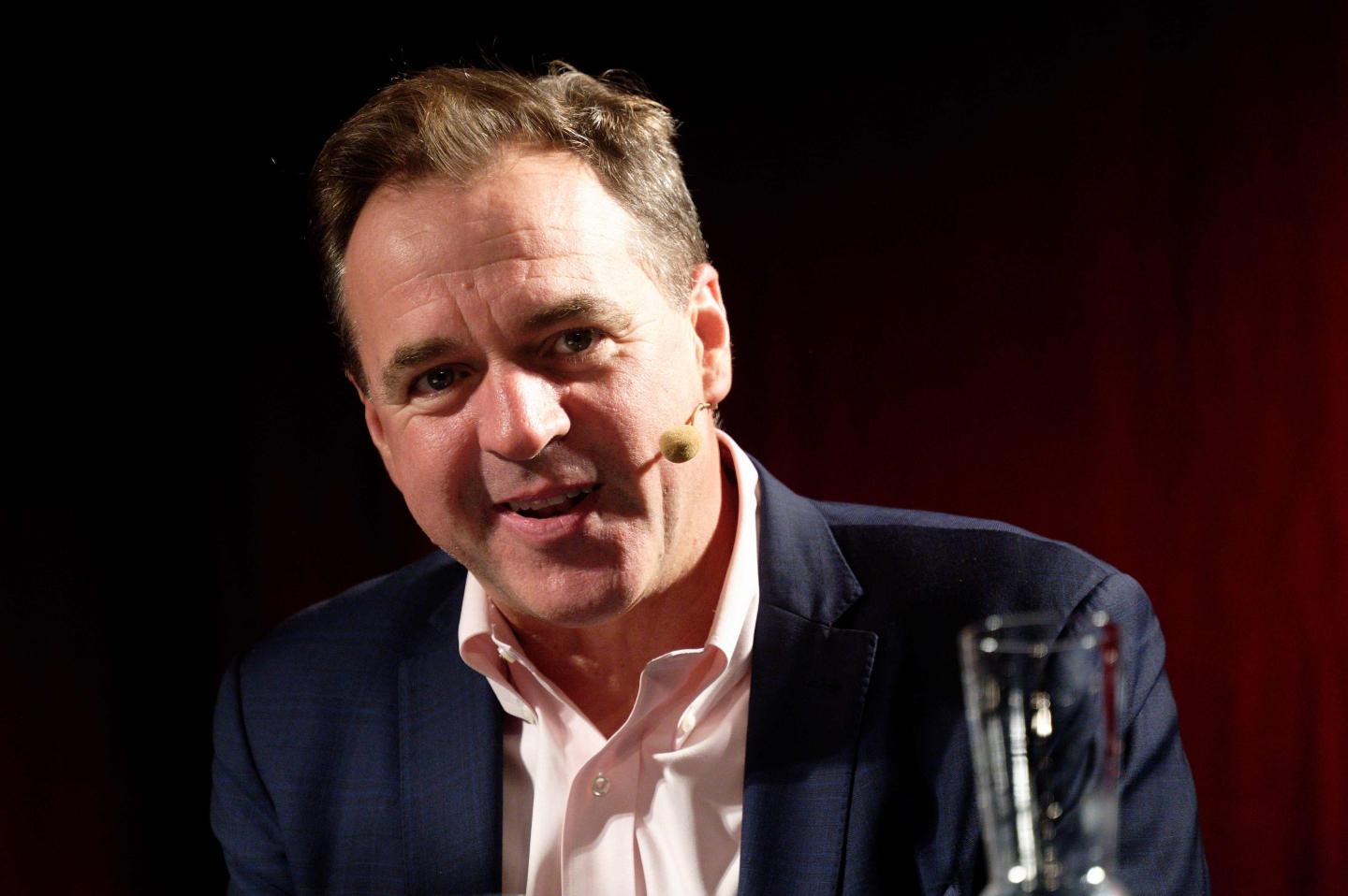 Historian Niall Ferguson sits on the podium at one of the events "Doom - the Politics of Catastrophe." as part of the phil.cologne on the podium.
