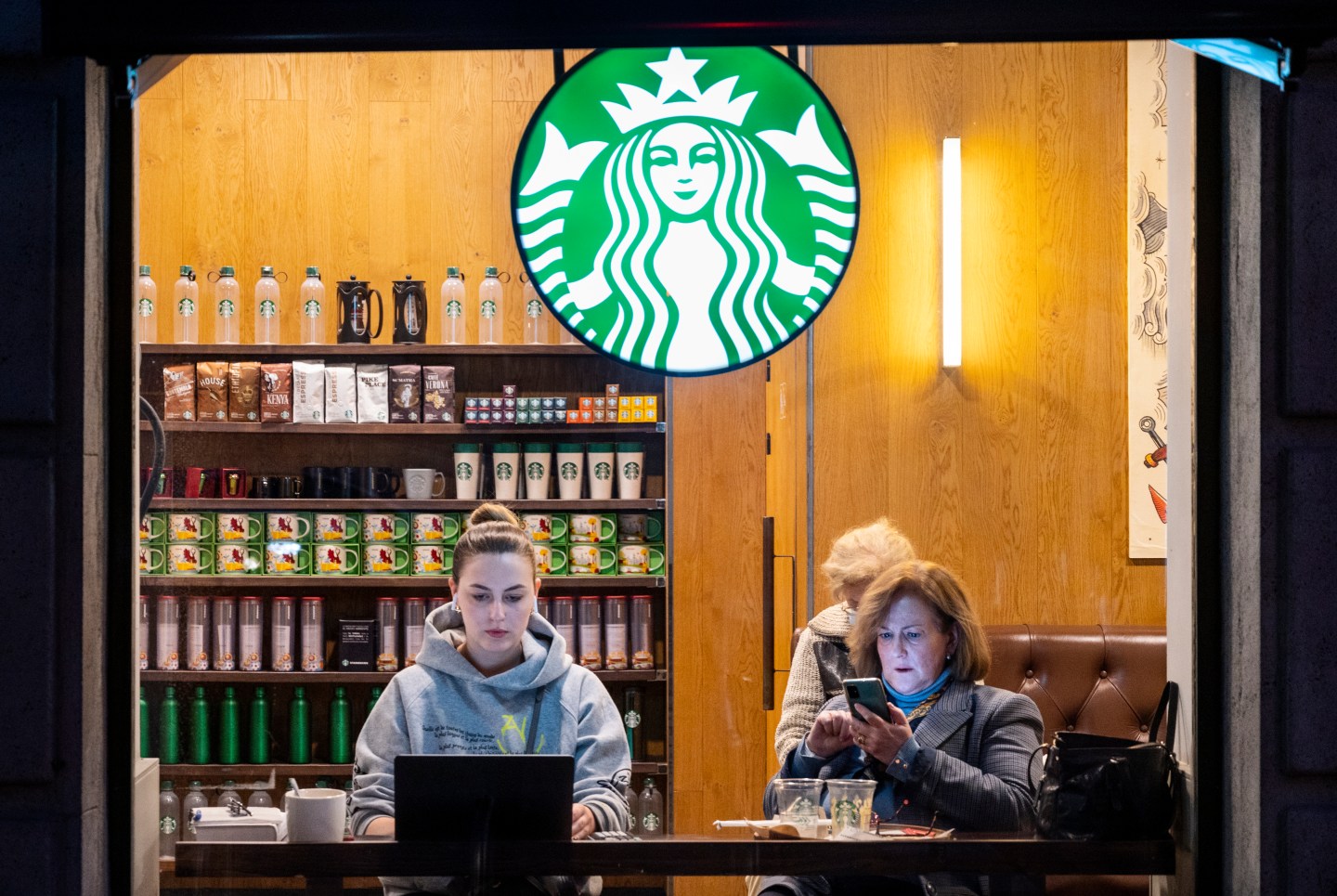 People sitting at a Starbucks.