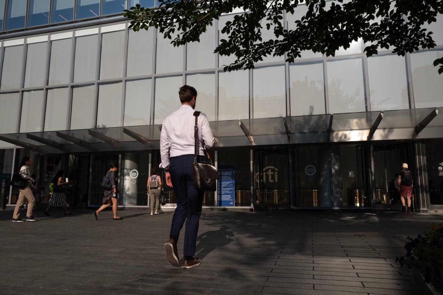 Man walking into Citi.
