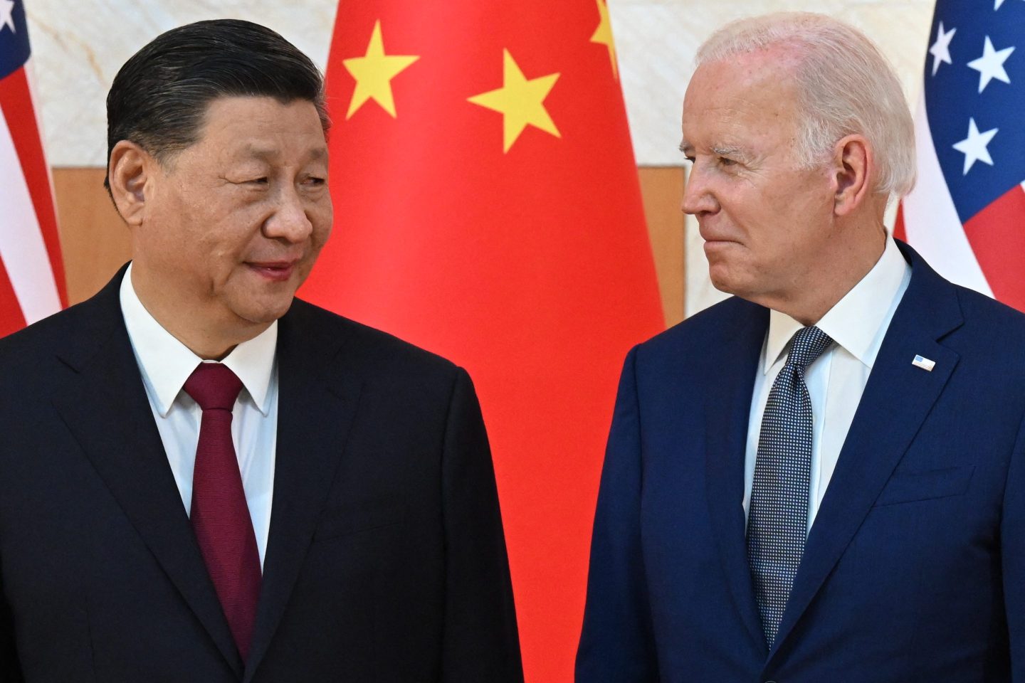 US President Joe Biden (R) and China's President Xi Jinping (L) meet on the sidelines of the G20 Summit