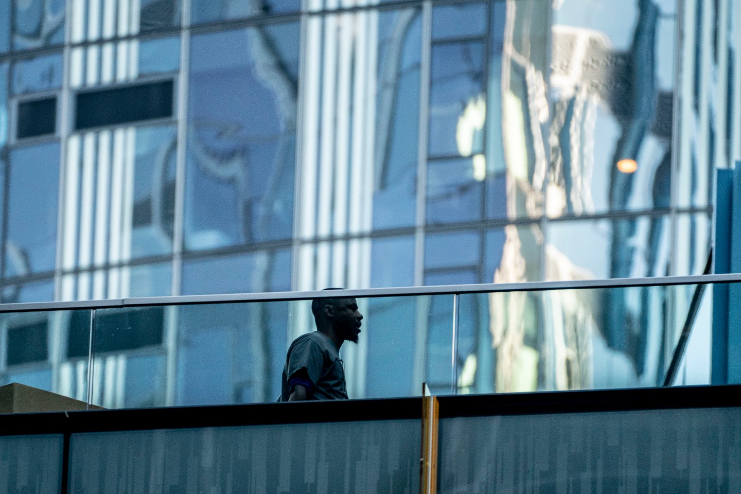 A person walks between buildings at the Amazon.com Inc. headquarters on Nov. 14, 2022 in Seattle. On 5 January, the tech giant announced that it would be cutting 18,000 jobs.