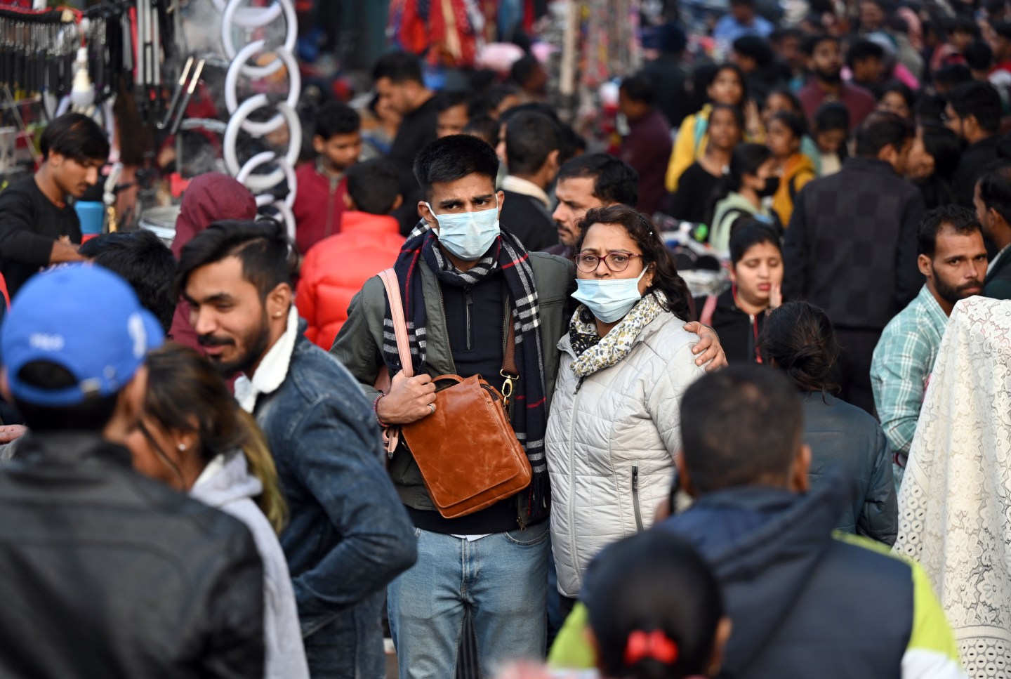 People wear masks as a precautionary measure from COVID at Sarojini Nagar Market on Dec. 22 in New Delhi, India. Of 85 patients with XBB COVID variants surveyed in Maharashtra, India, during the later half of 2022, most were symptomatic. But the majority were able to cope with infection at home, versus in a hospital. For most, the symptoms could have been much worse.