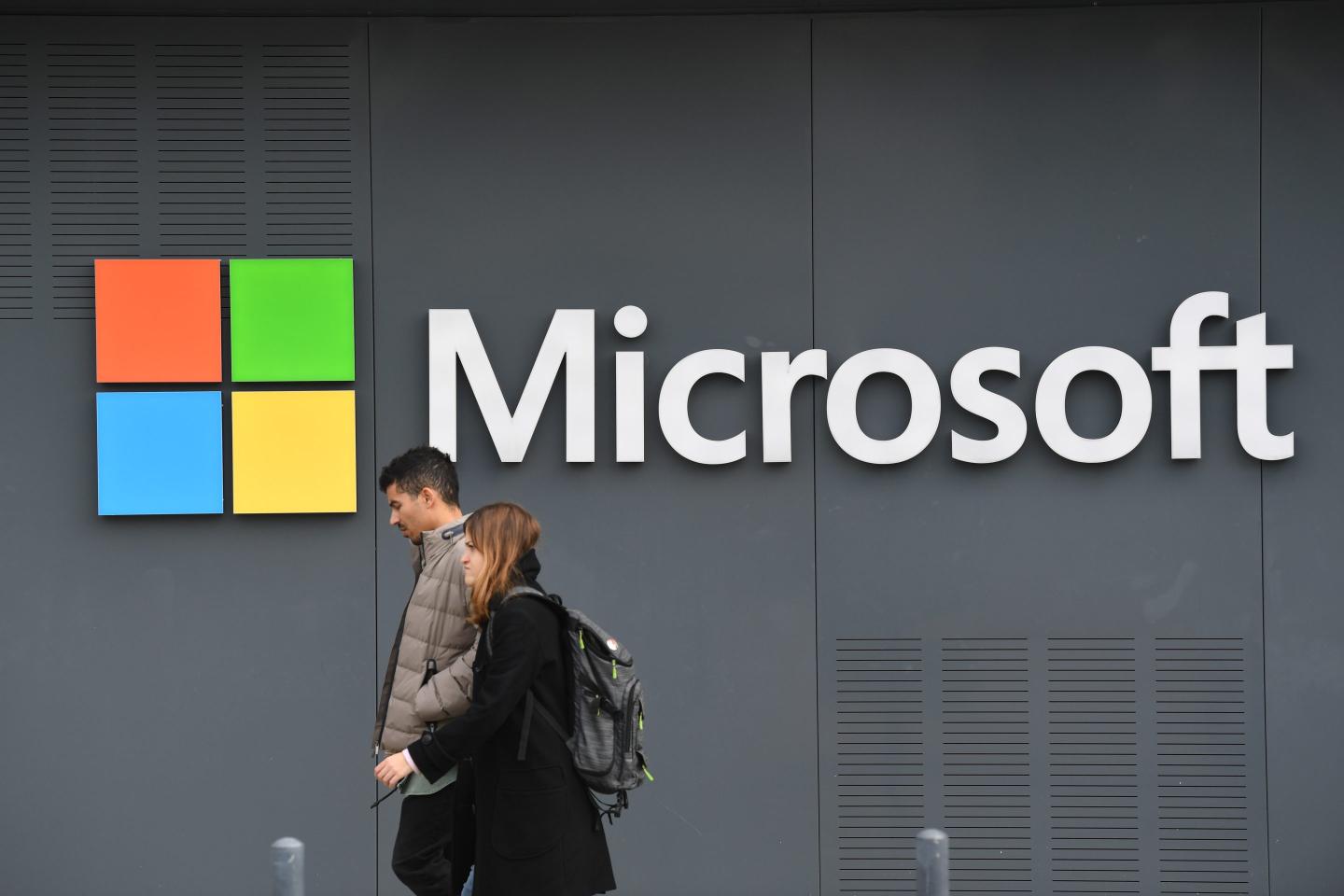 a Microsoft logo on the side of an office building