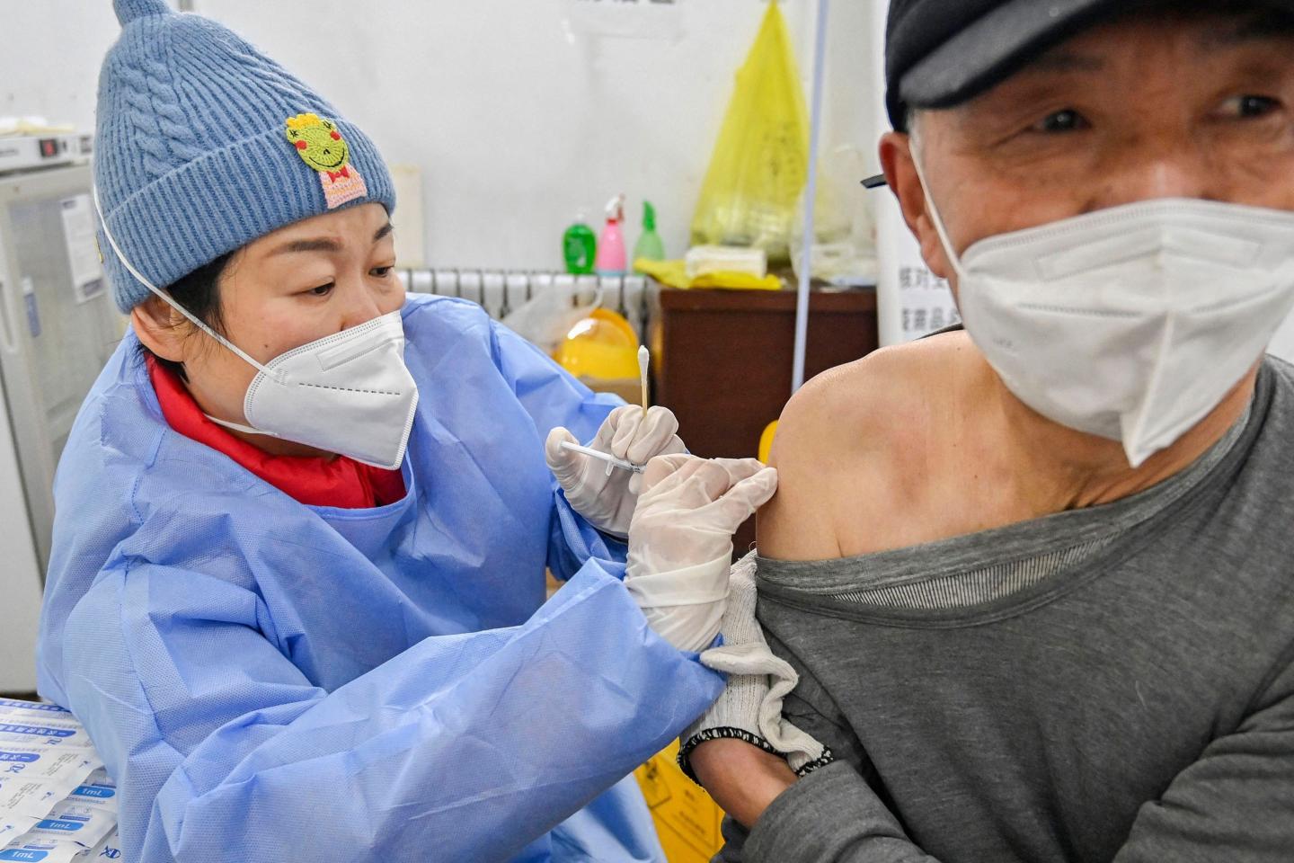 A Chinese patient receives a COVID shot