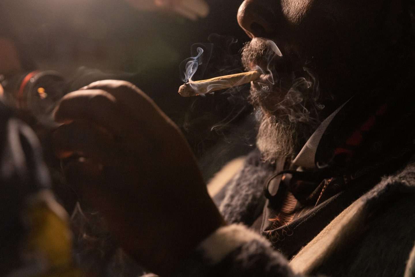 a man smoking marijuana.