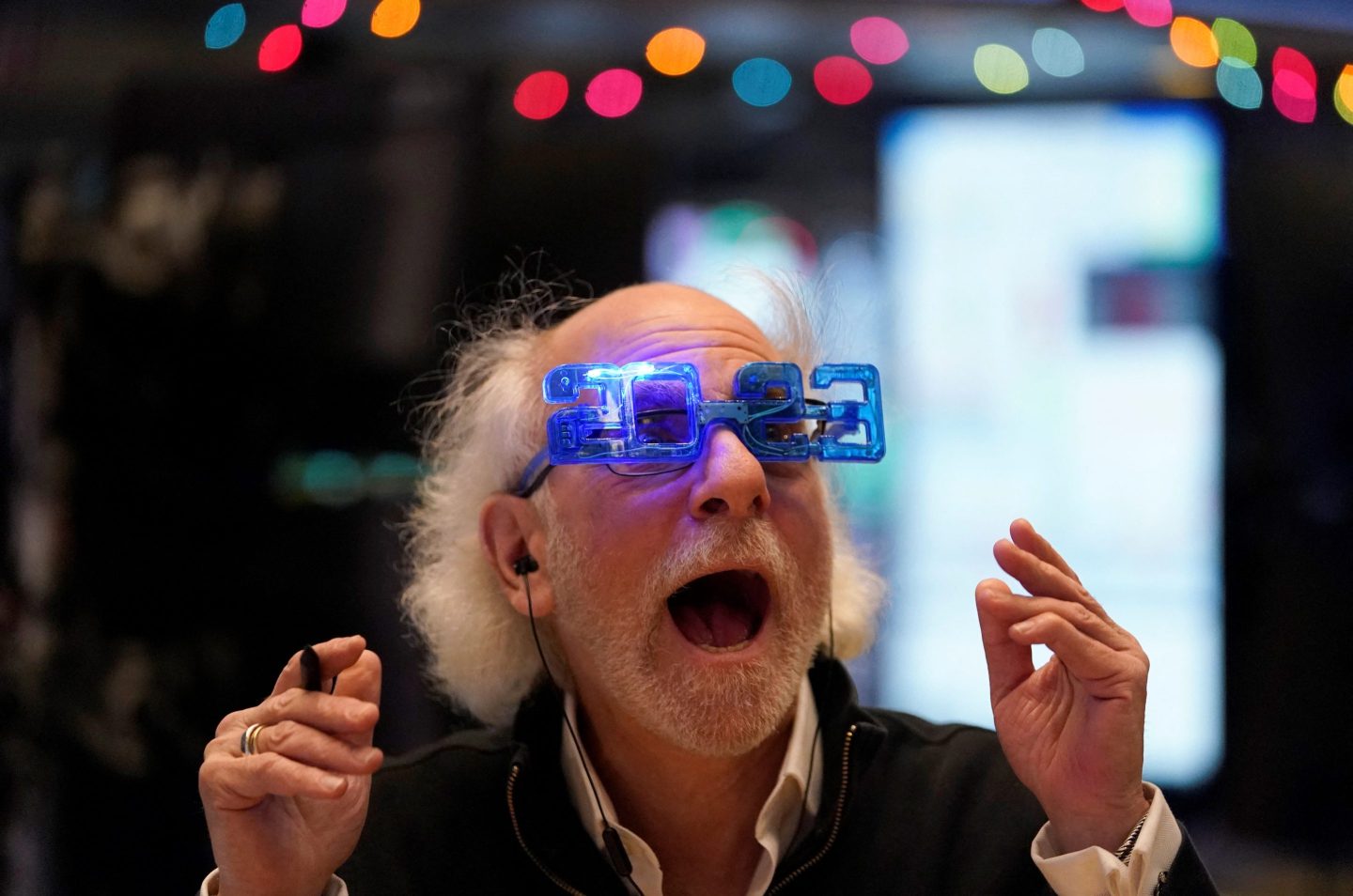 Stock trader Peter Tuchman reacts on the floor of the New York Stock Exchange at the closing bell on Dec. 30, 2022, in New York.