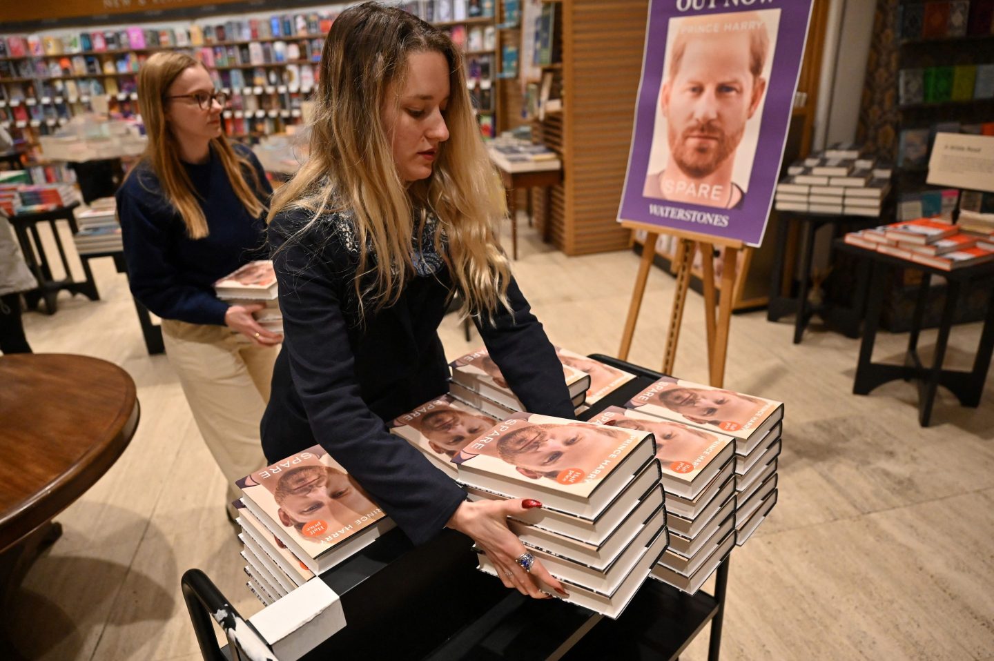 Booksellers carry copies of "Spare" by Britain's Prince Harry
