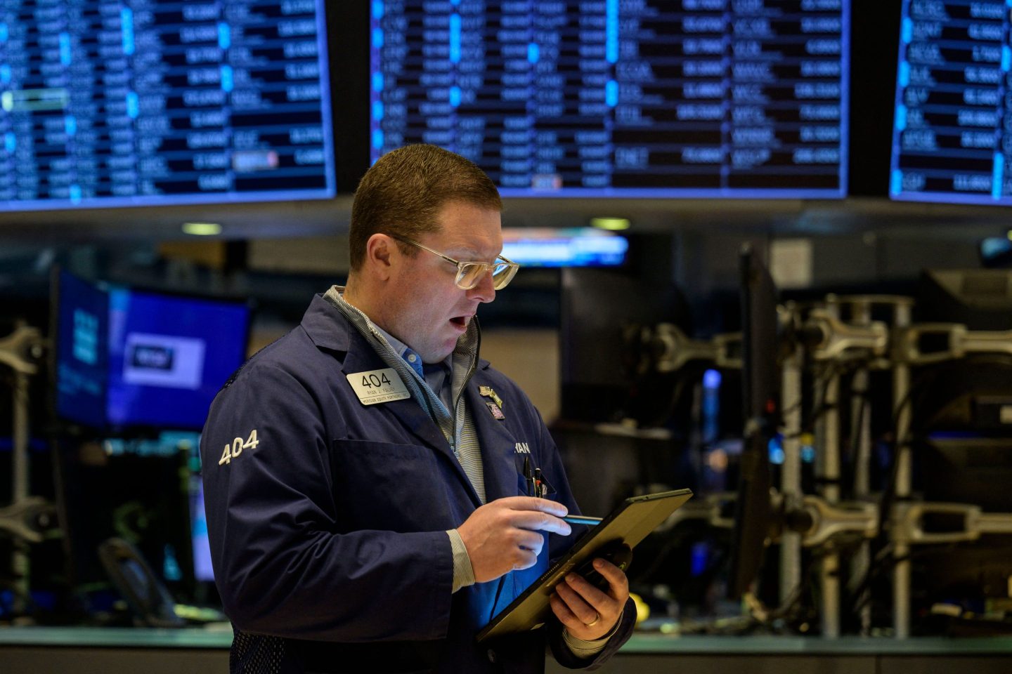 Traders work on the floor of the New York Stock Exchange during opening bell in New York City on January 18, 2023.