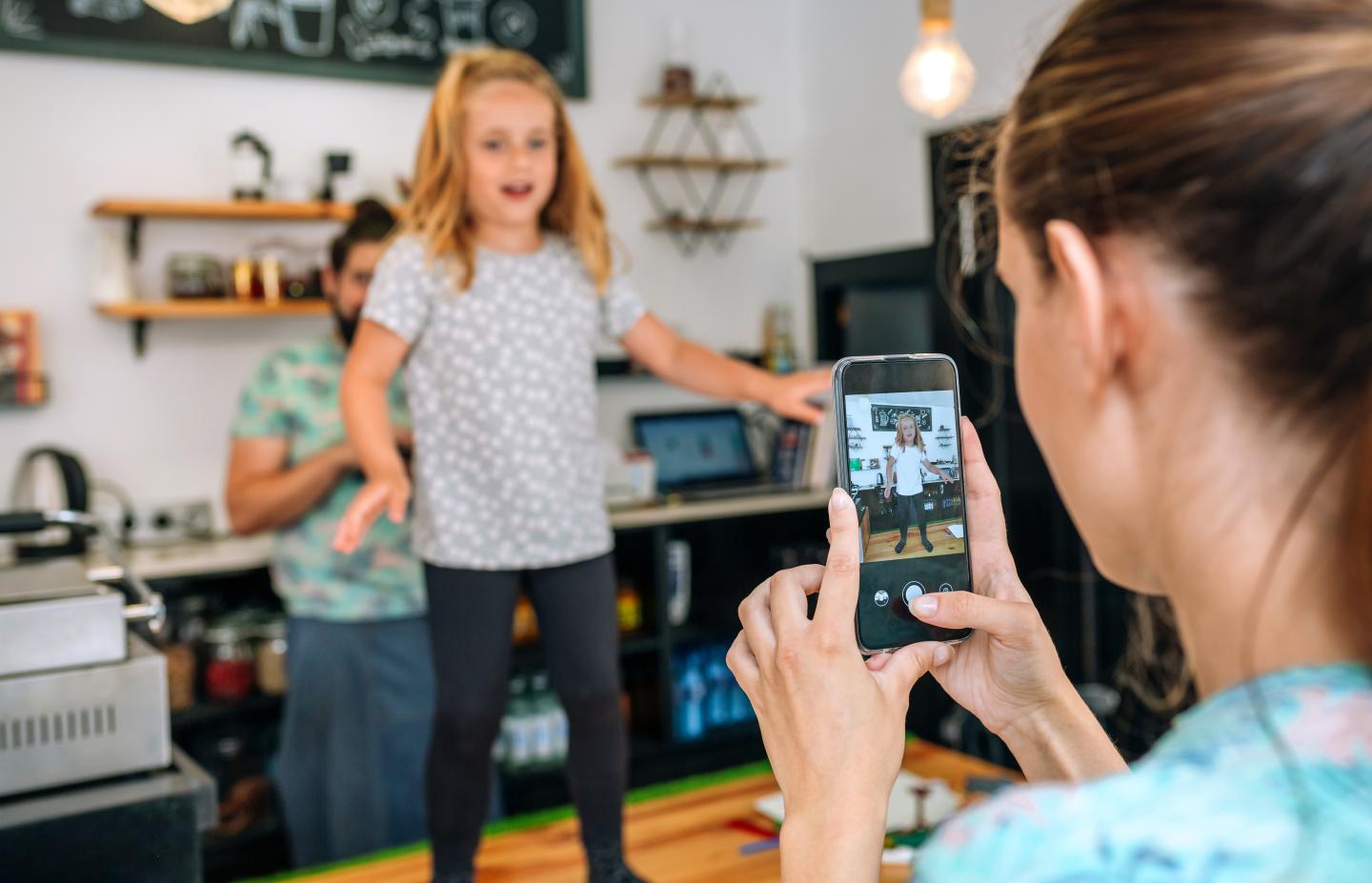 Parent taking photo of kid