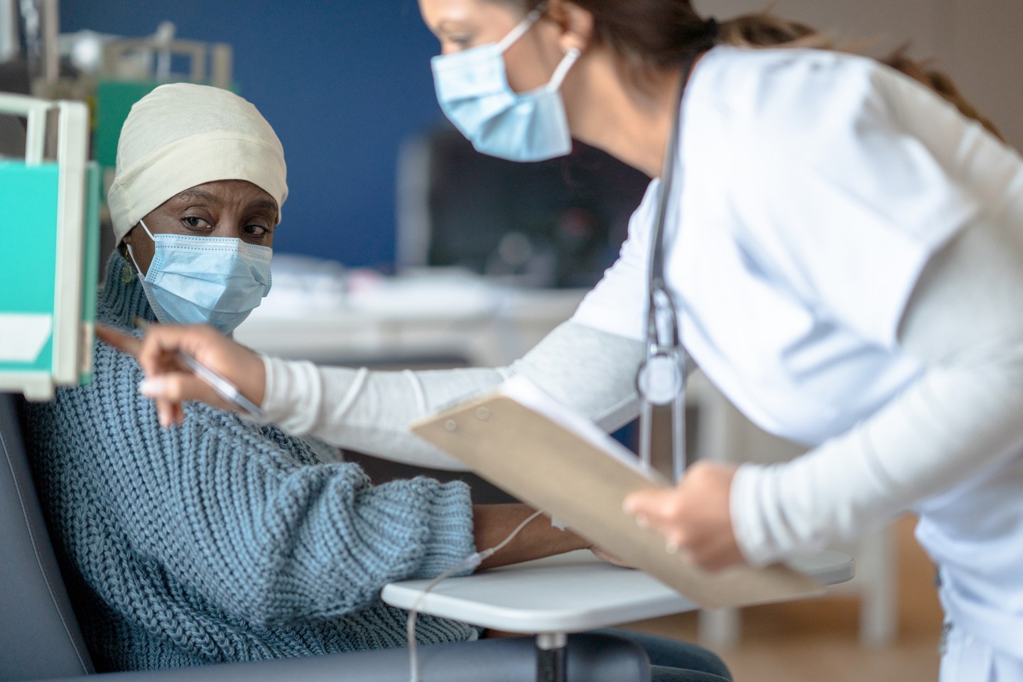 A nurse assists a cancer patient