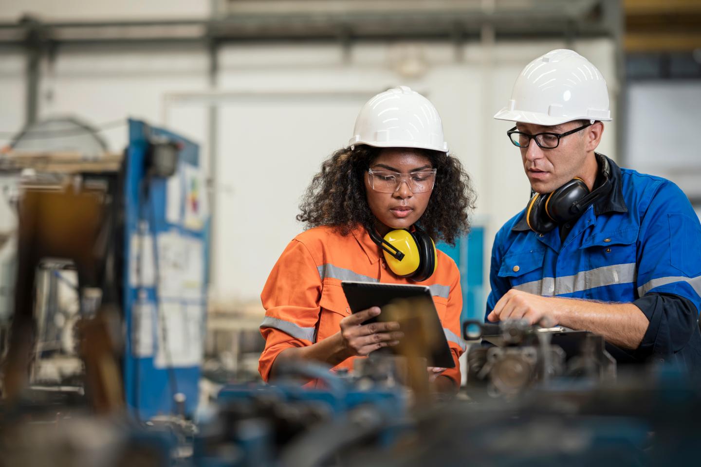 Factory workers having a discussion.