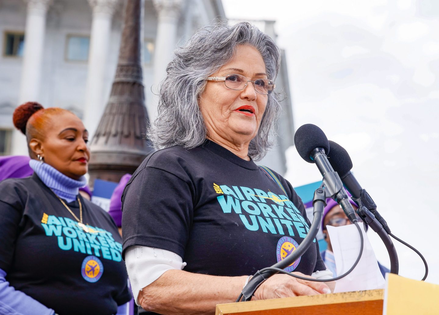 Verna Montalvo speaks during a press conference held by airport workers to ask Congress to pass the "Good Jobs for Good Airports Act" on Capitol Hill on Dec. 8.