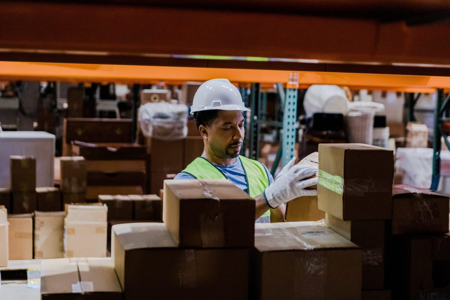 Manager in warehouse performs quality control