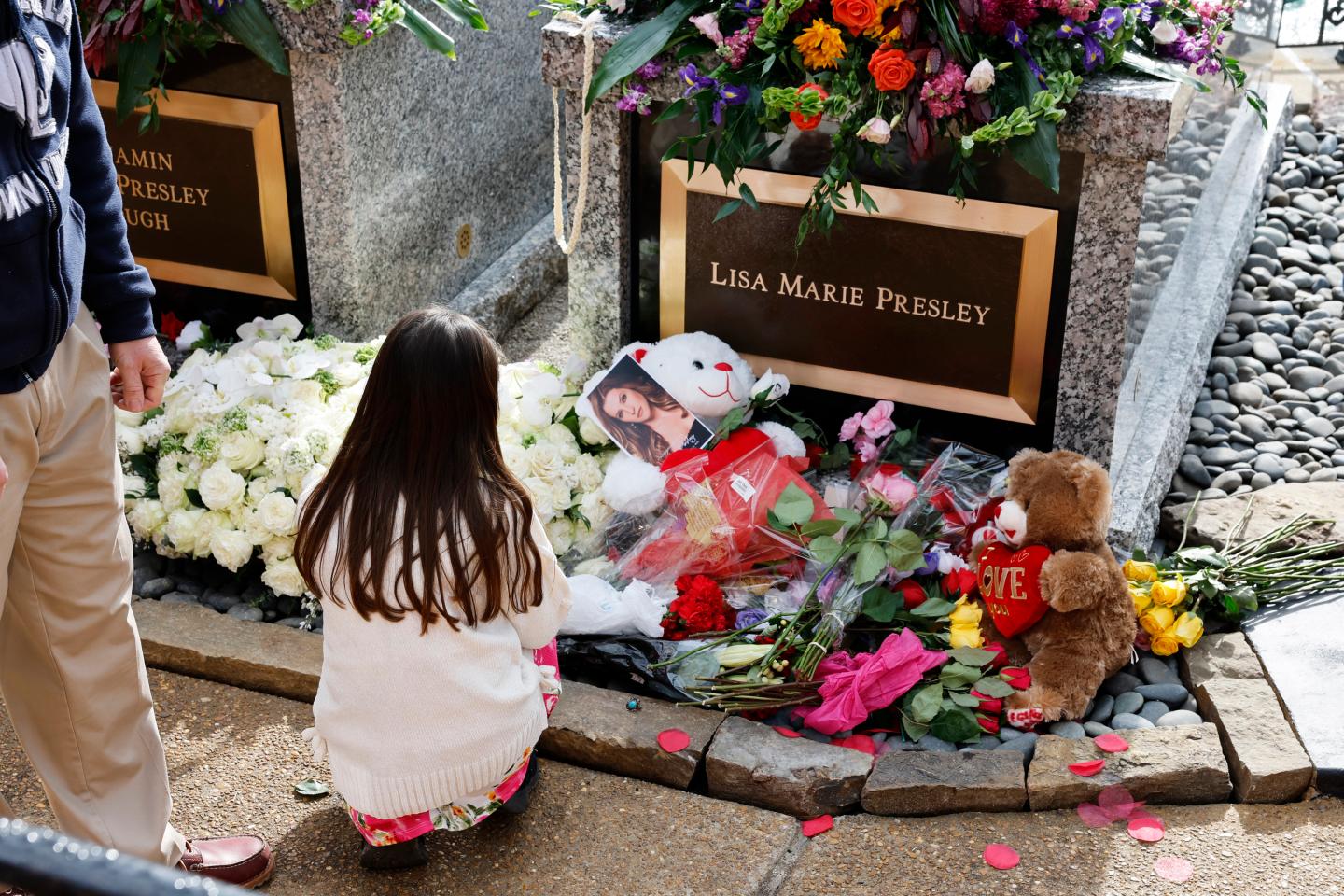 Fans visit the grave of Lisa Marie Presley.