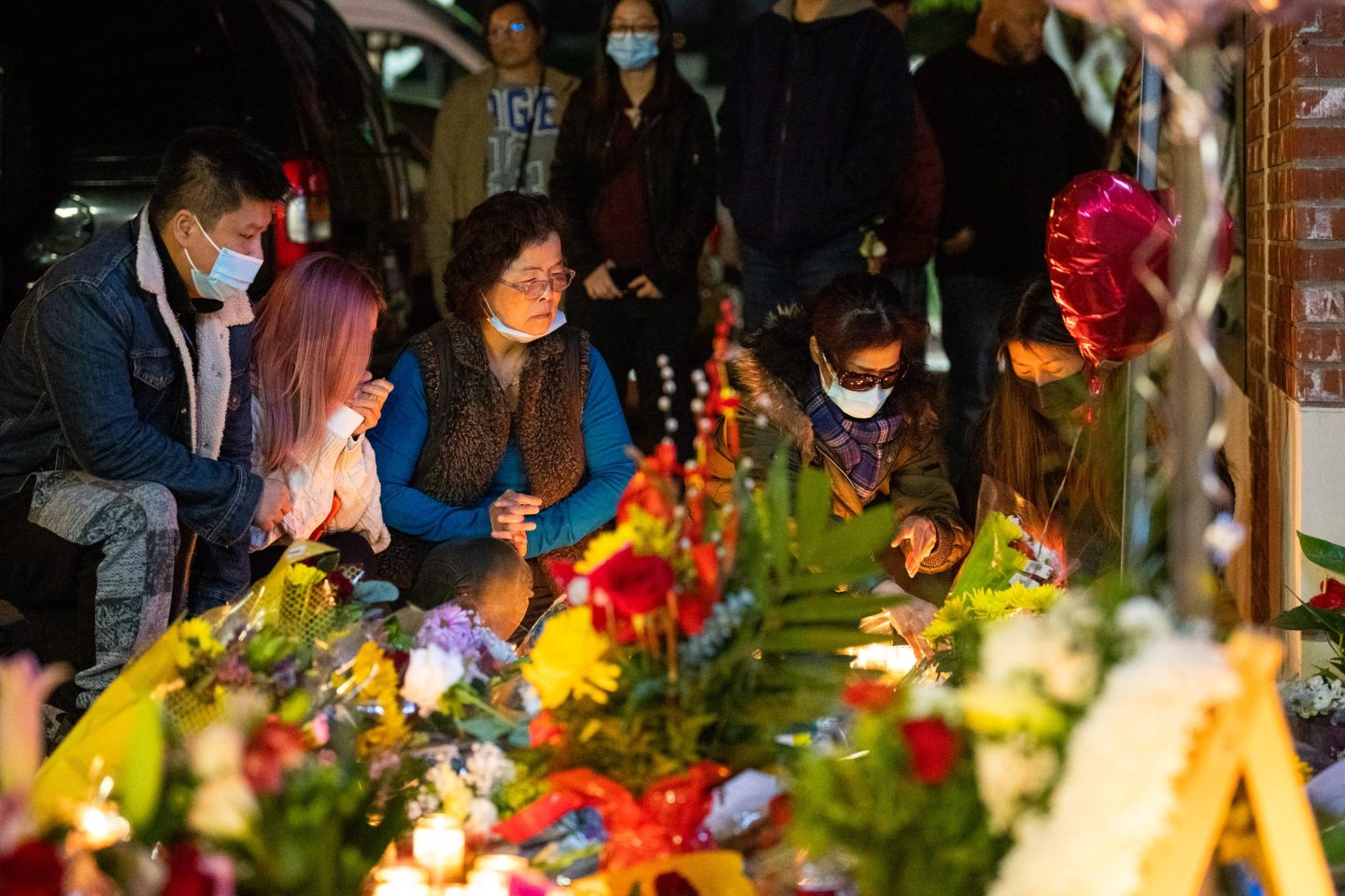 Mourners attend a candlelight vigil for victims of a mass shooting on January 23rd in Monterey Park.