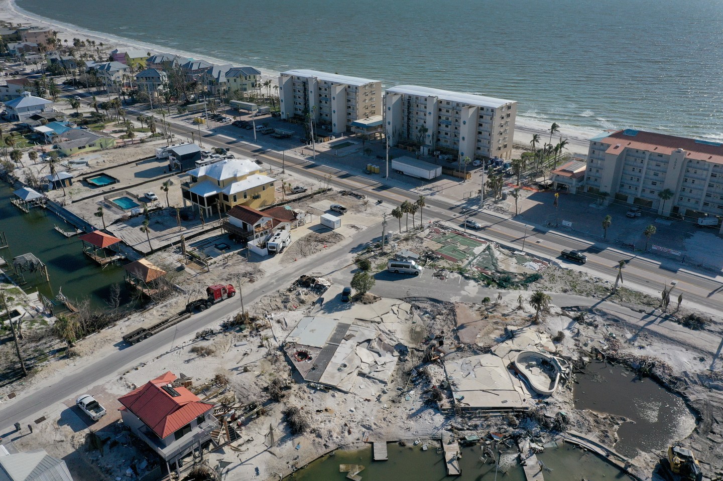 An aerial shot of concrete rubble and flattened buildings