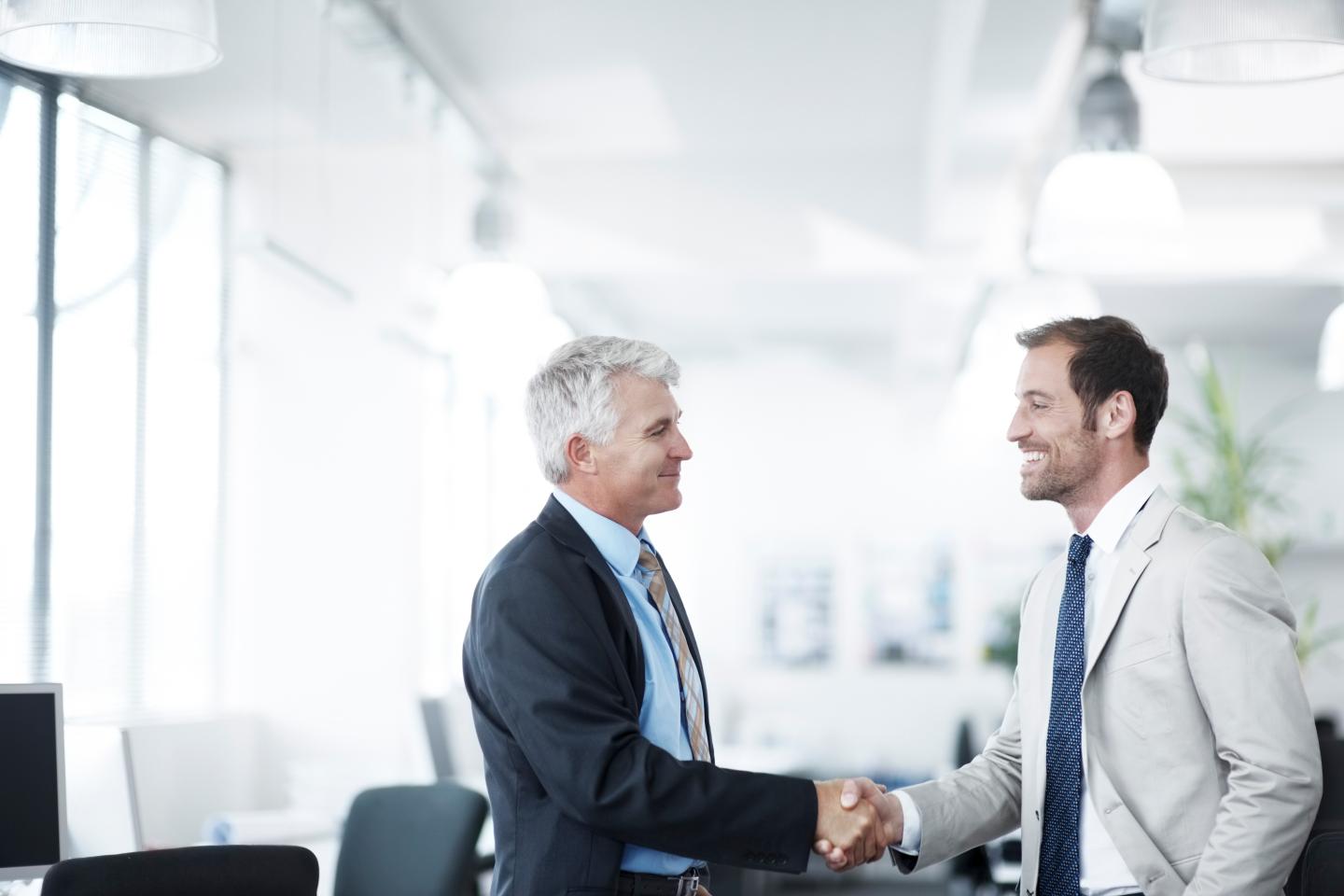 Workers shaking hands