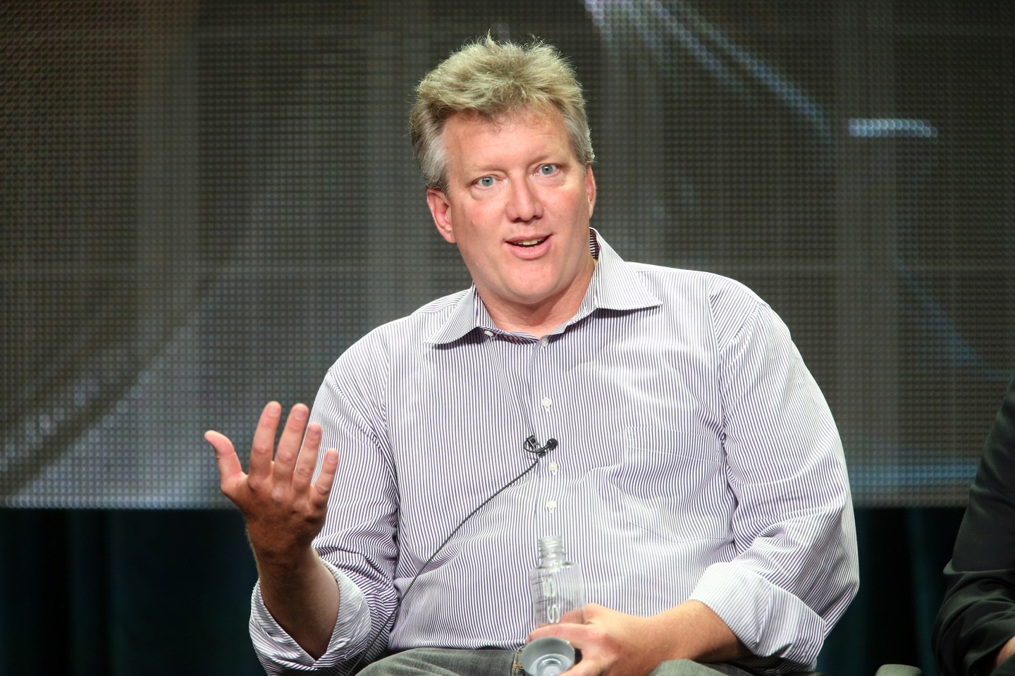 Film producer Chris Moore speaking at a panel in 2014