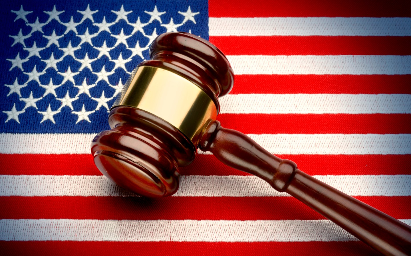 Judge's gavel on American flag.