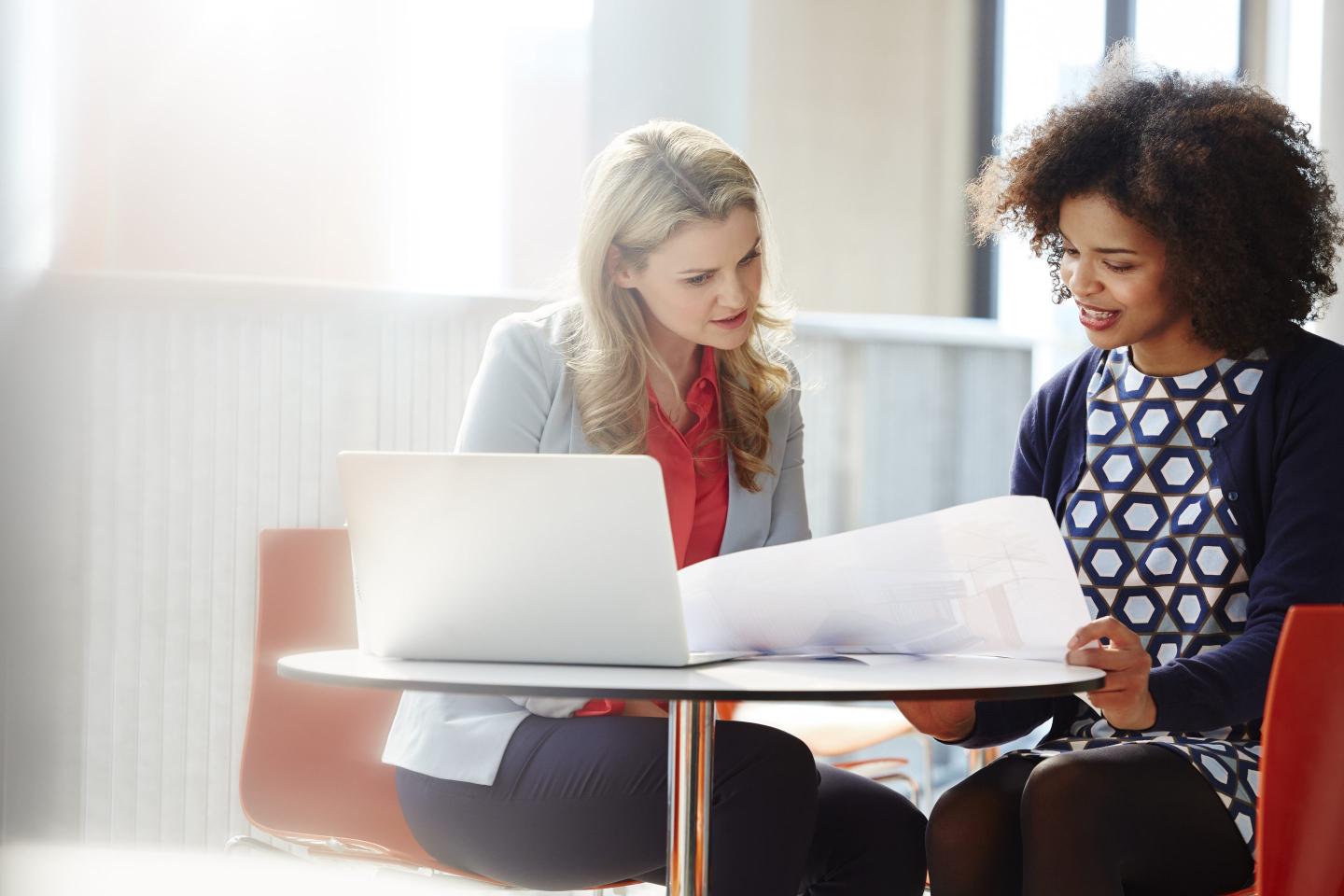 Two businesswomen discussing plans