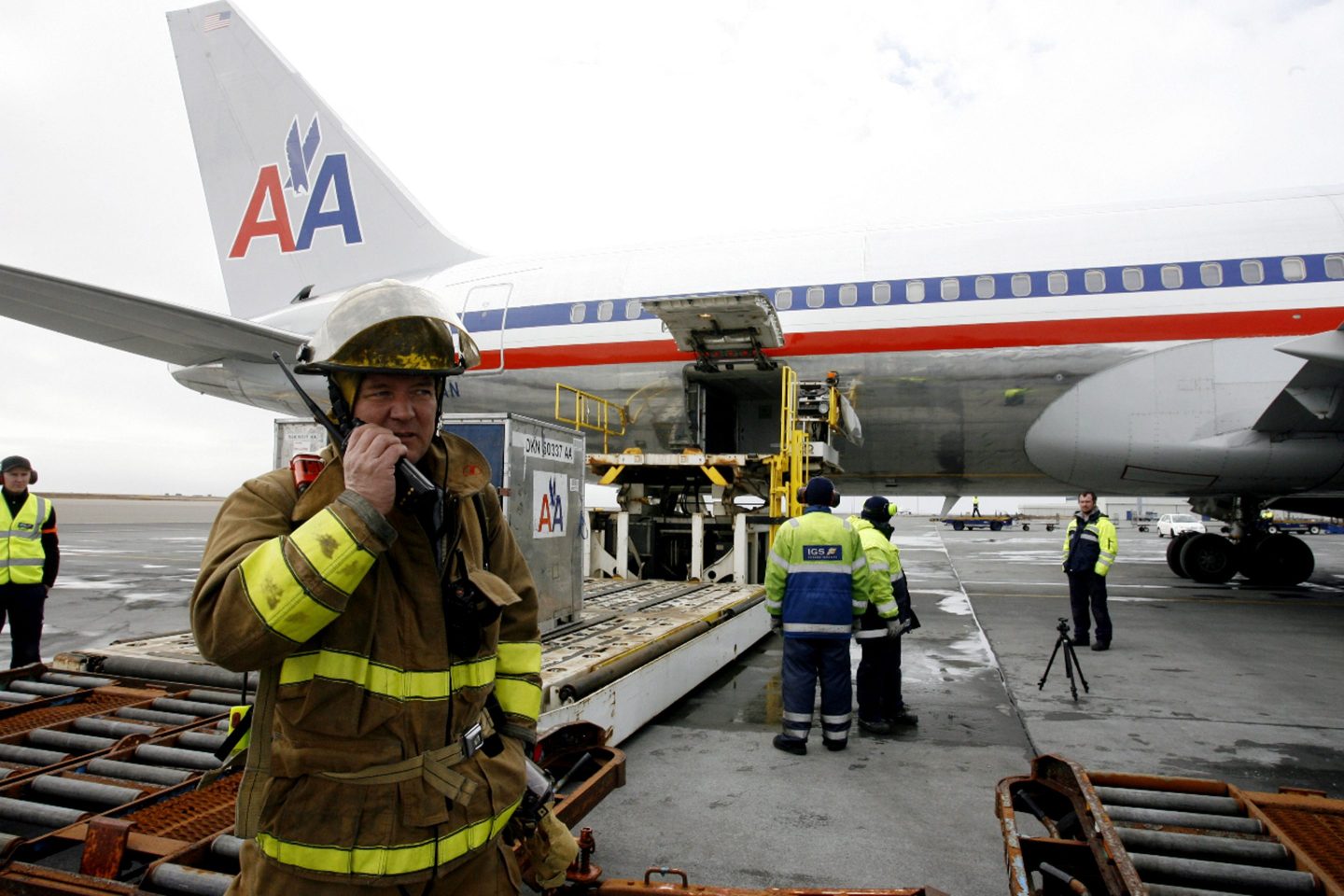 Emergency workers stand by an American Airlines plane that flew from Paris to Fort Worth, Texas, in 2010 but made an emergency landing in Iceland after the pilot smelled fumes.