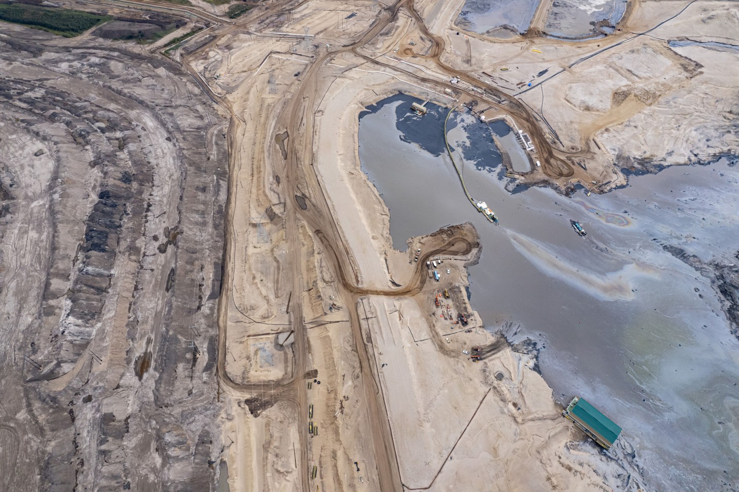 An oil-sands mining site in Alberta, Canada. Enbridge Energy, whose pipelines carry crude to the U.S. from the region, has received $100 billion in financing from banks that have signed “net-zero” pledges, despite the massive carbon footprint of tar-sands oil.