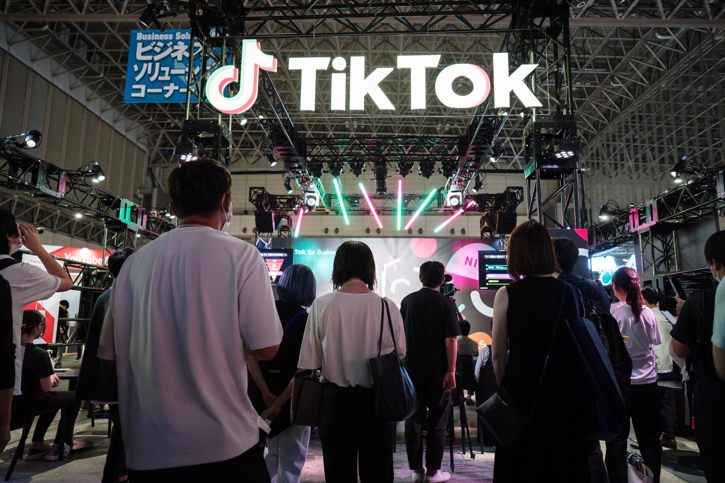 Attendees stand outside the TikTok booth at the Tokyo Game Show 2022.
