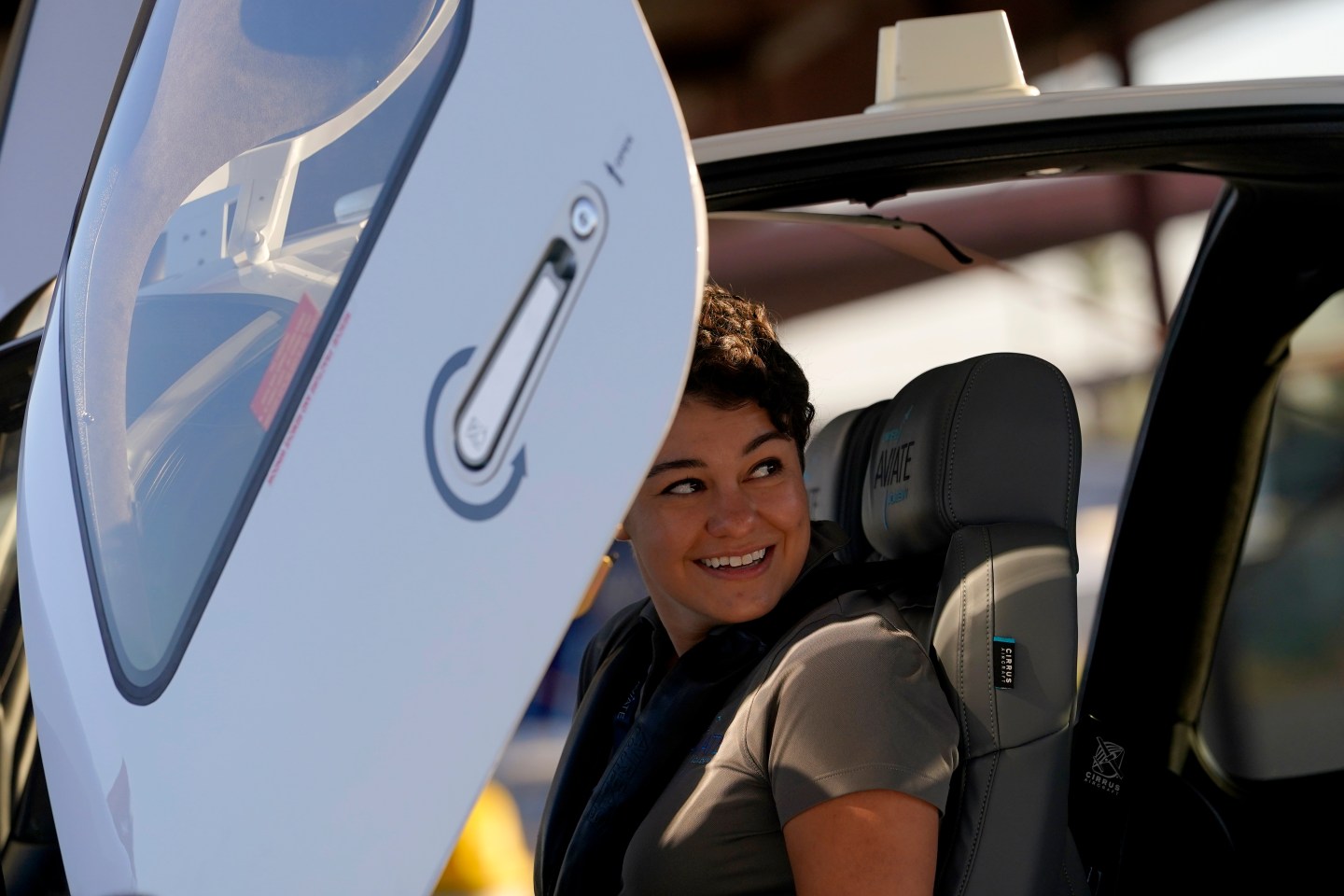 United Aviate Academy student pilot Ashley Montano inspects her aircraft prior to a flight, Friday, Oct. 28, 2022, in Goodyear, Ariz