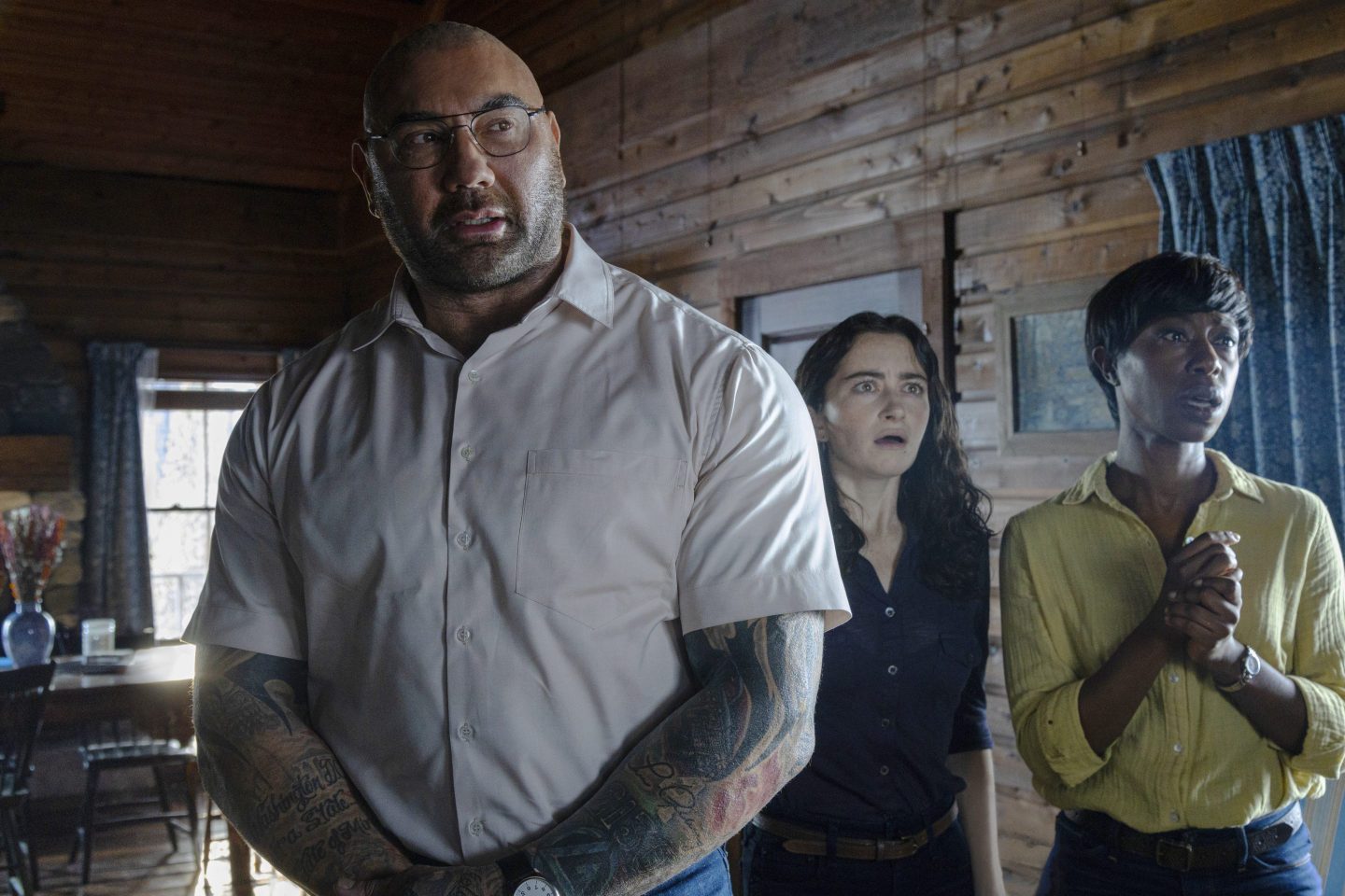 Dave Bautista, from left, Abby Quinn, and Nikki Amuka-Bird in a scene from "Knock at the Cabin."