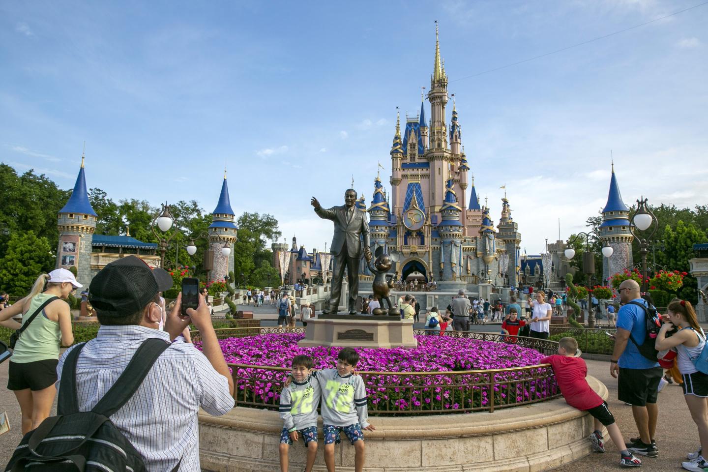 People visit Magic Kingdom Park at Walt Disney World Resort in Lake Buena Vista, Florida, in April 2022.