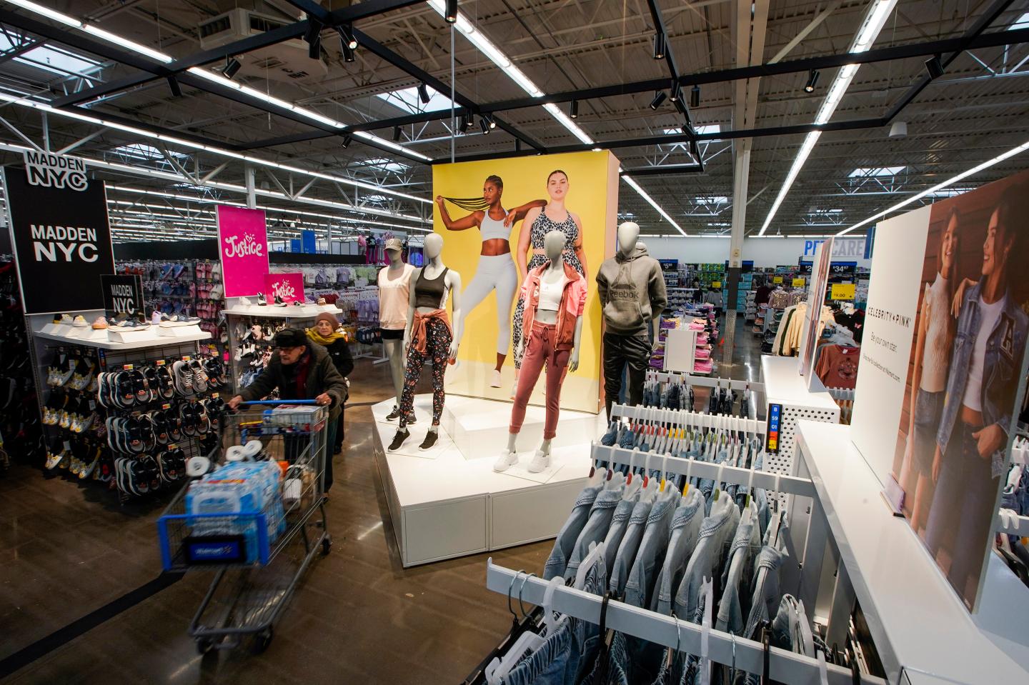 Customers walk around the Walmart Supercenter, Thursday, Feb. 9, 2023, in North Bergen, N.J. 