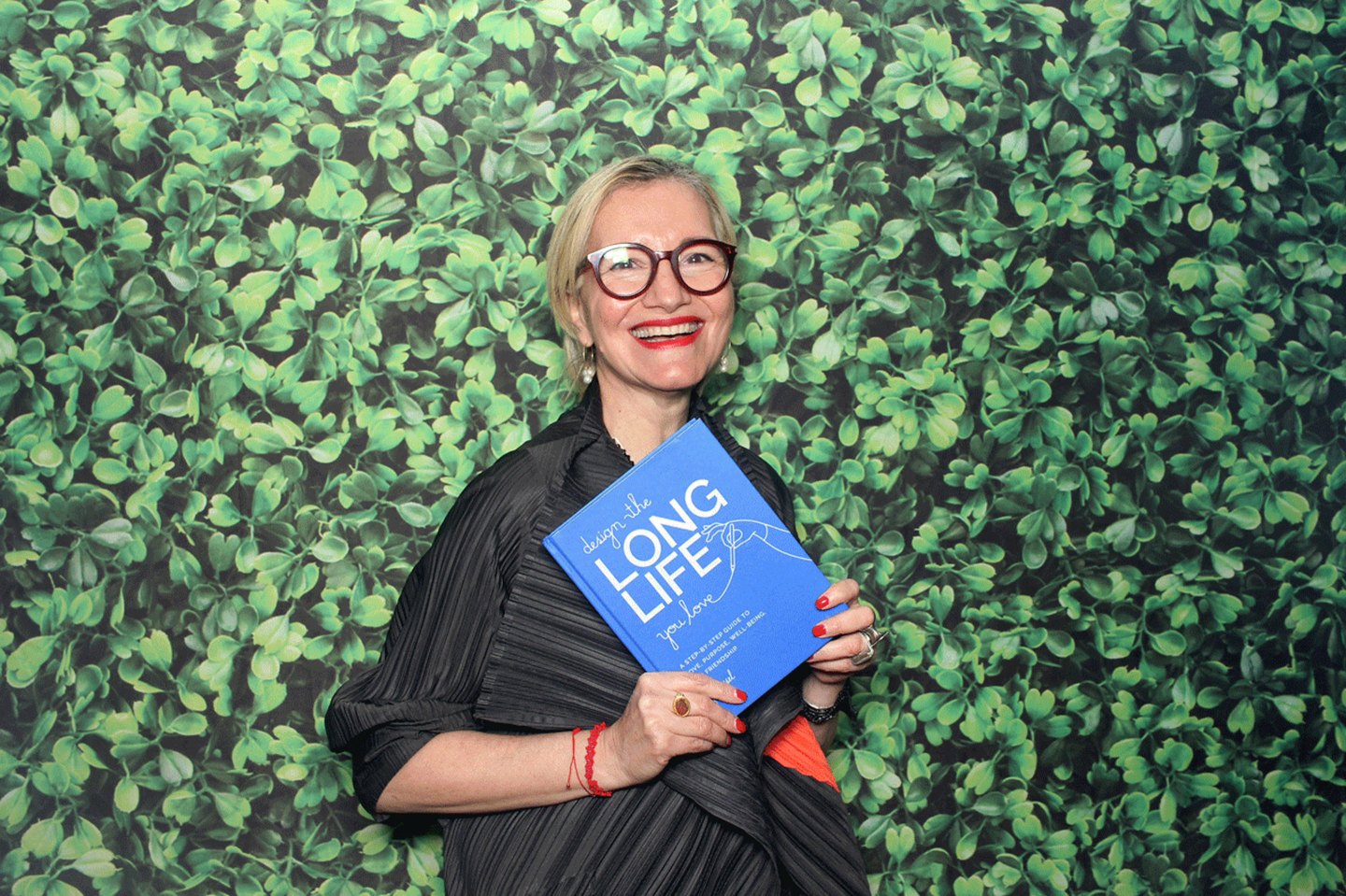 Photo of designer Ayse Birsel holding her new book Design The Long Life You Love