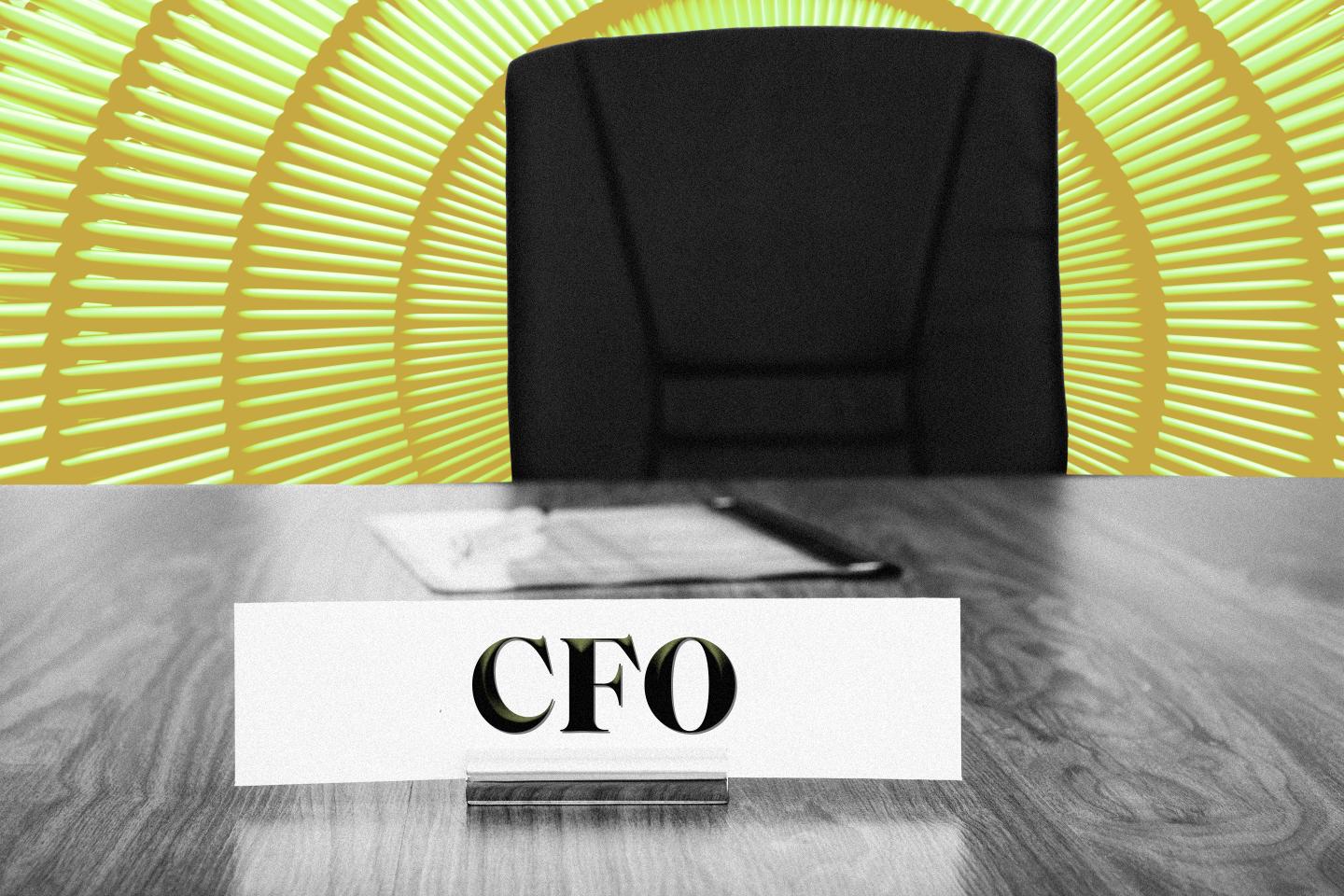 Name plate on desk that reads CFO.