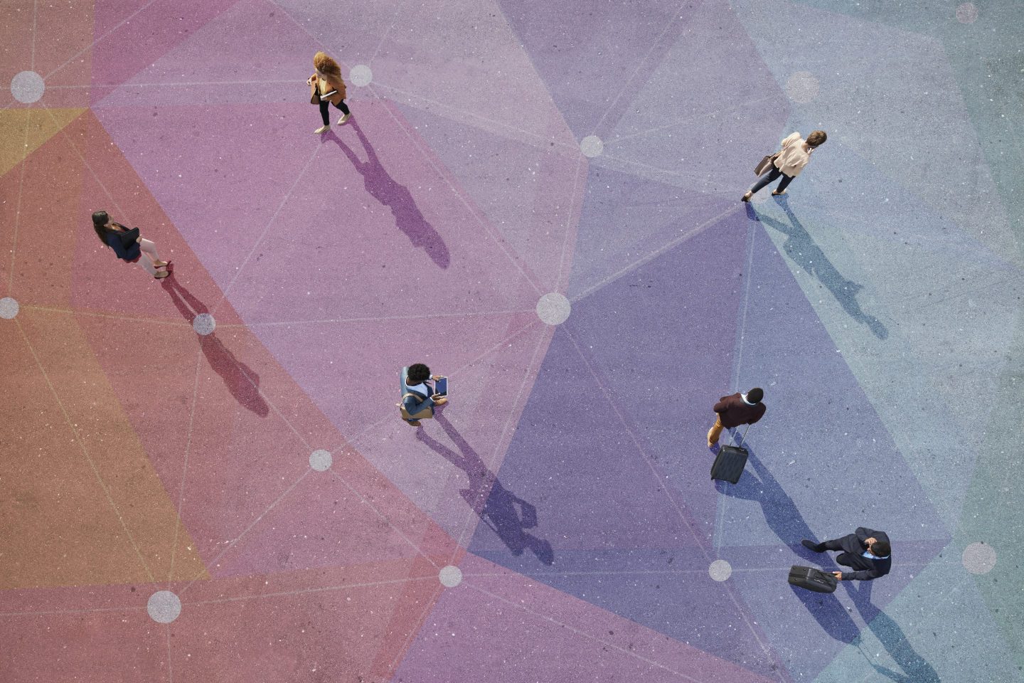 Top view of people walking in different directions of pattern, painted on asphalt