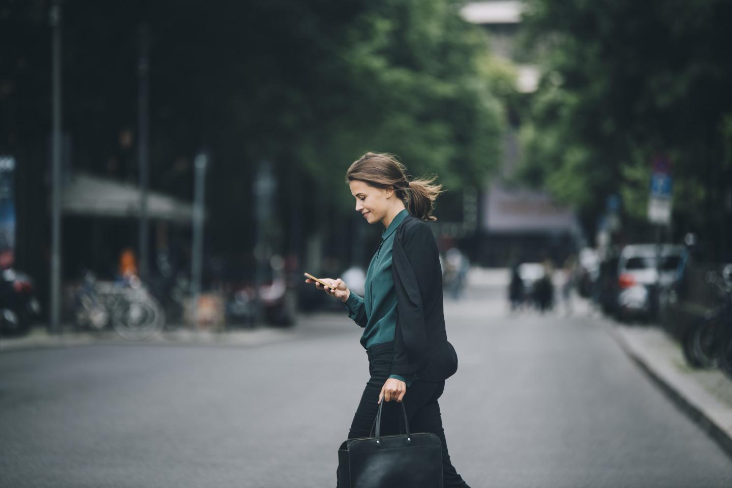 woman crossing street