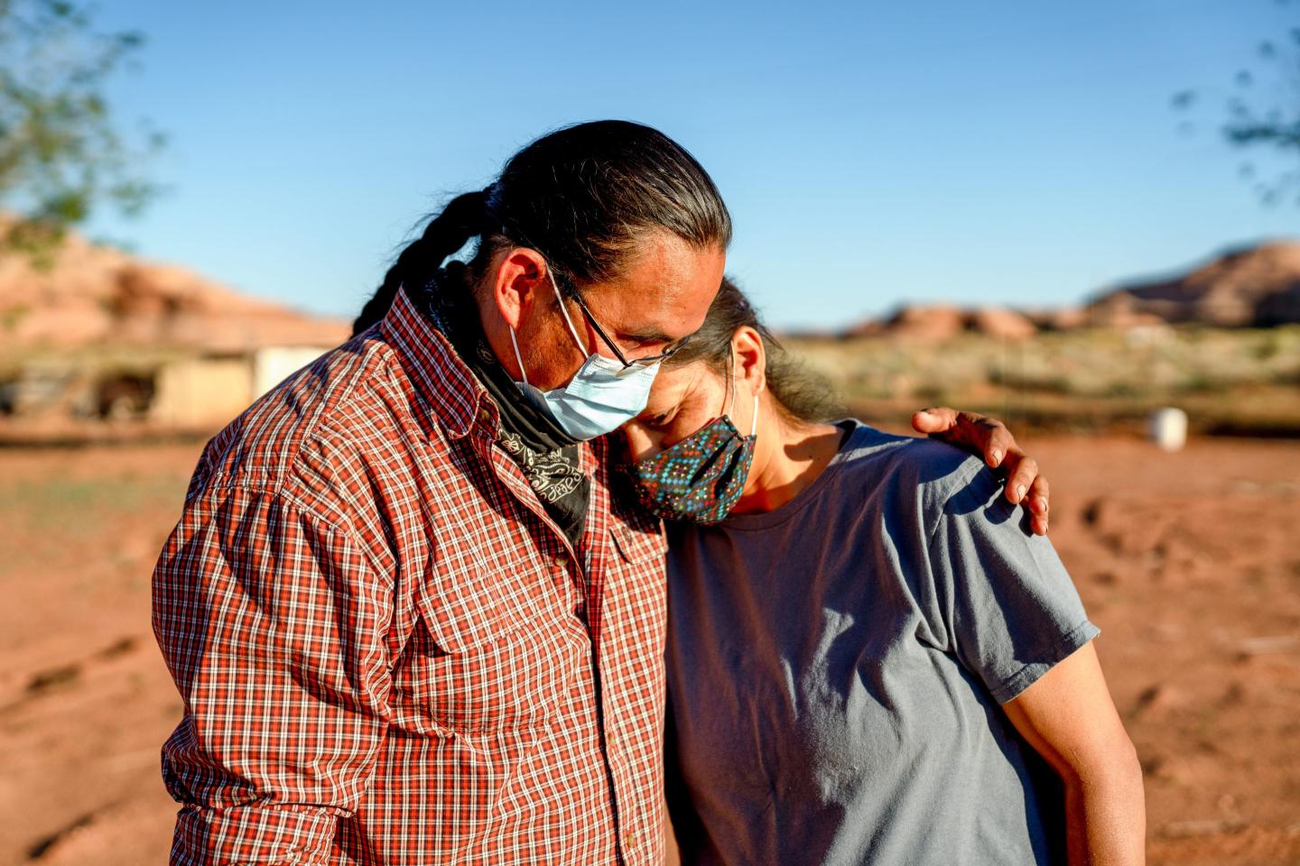 A husband comforts his wife.