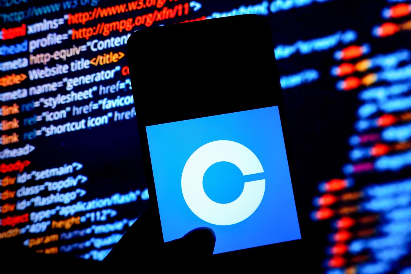 In this photo illustration, a Coinbase logo is displayed