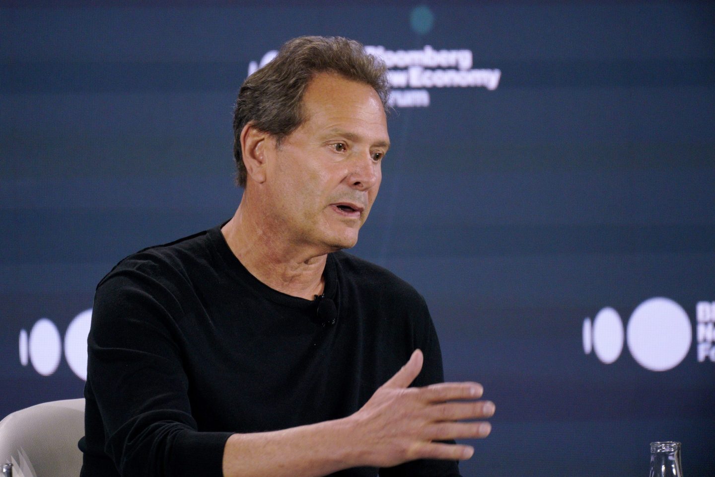 Dan Schulman speaks on stage at Bloomberg New Economy Forum.