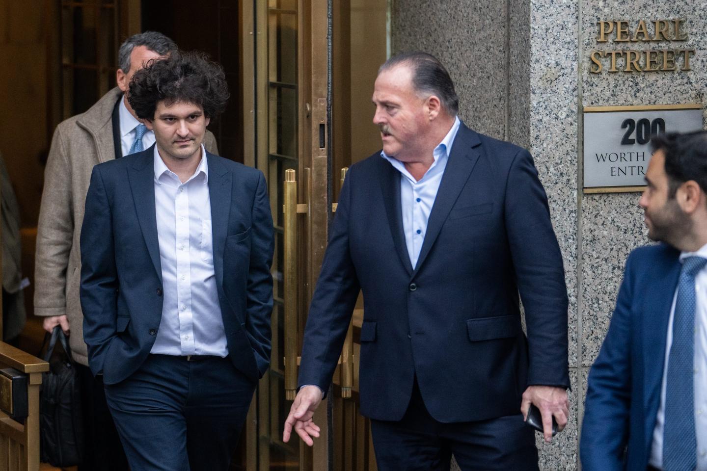 Sam Bankman-Fried leaves court hearing in New York.