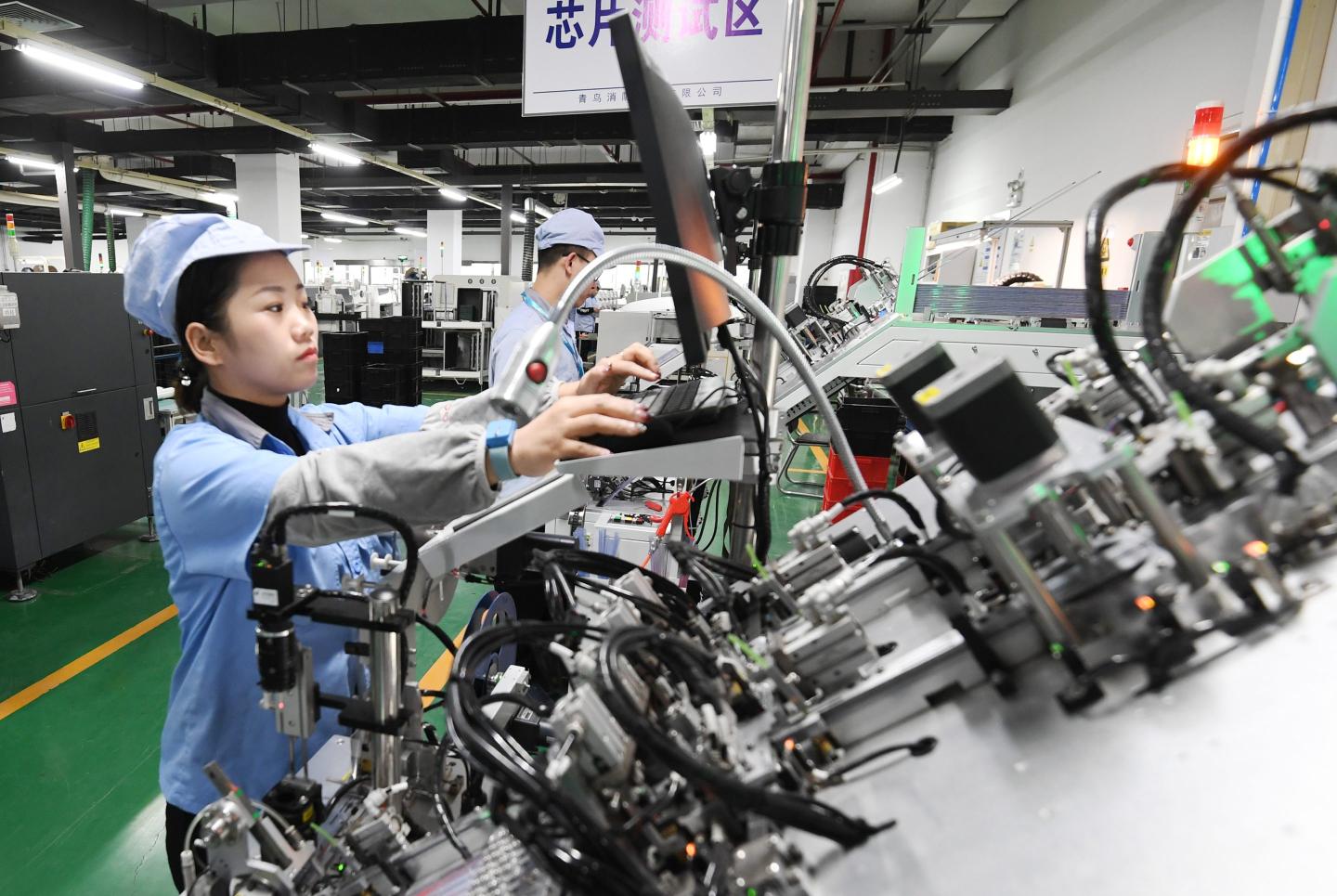 Workers on a chip detection production line in Hebei province, China