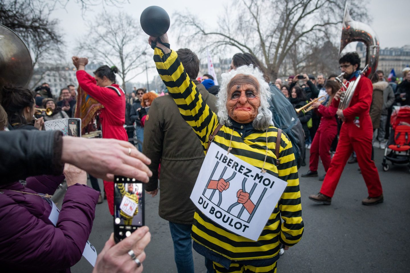 A demonstrator in a jail costume at a protest against government plans to revamp the pension system, in Paris, on Feb. 11, 2023. 